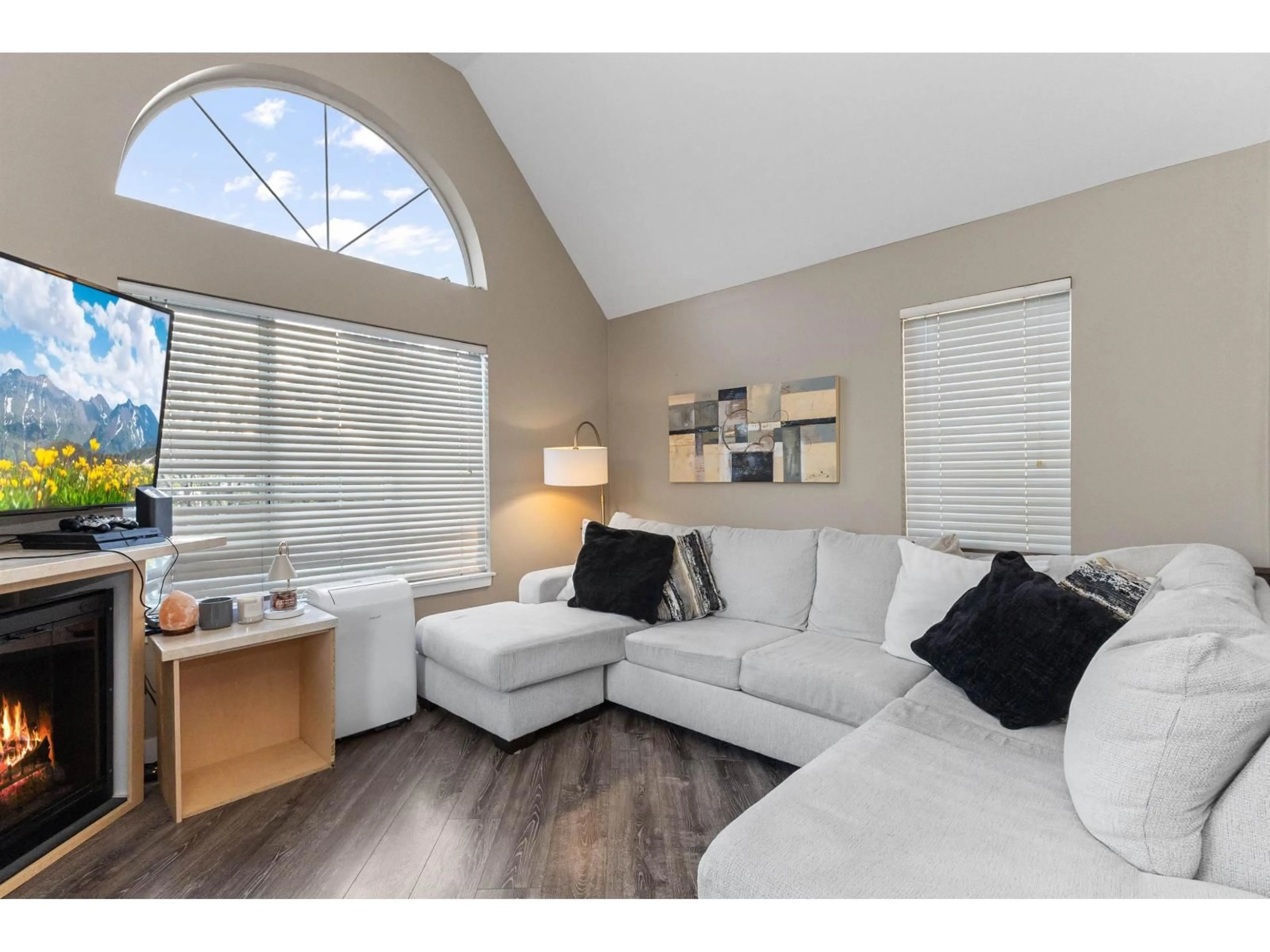 Living room with furniture, wood/laminate floor for 315 - 32725 GEORGE FERGUSON WAY, Abbotsford British Columbia V2T5M5