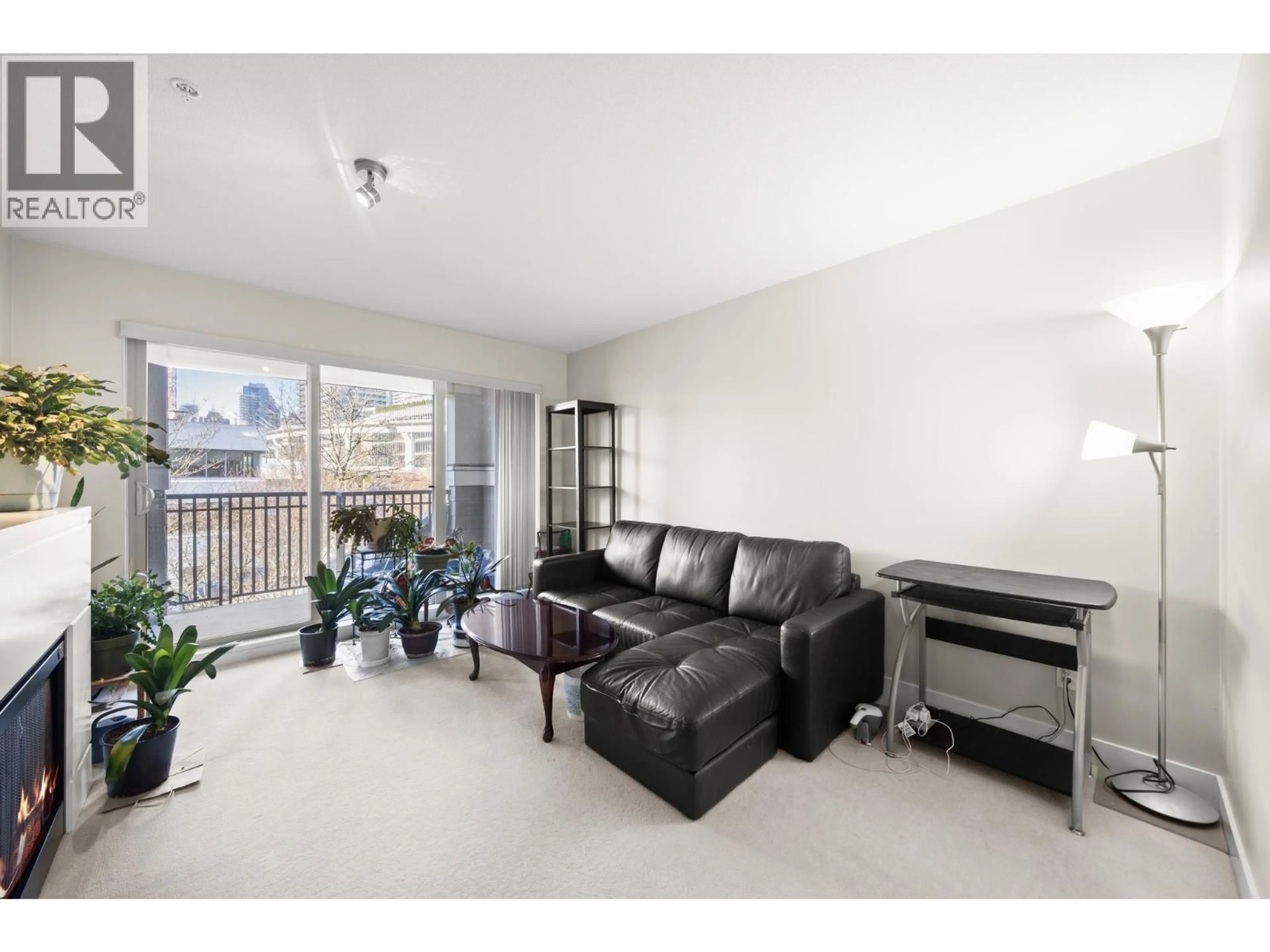 Living room with furniture, wood/laminate floor for 322 - 2088 BETA AVENUE, Burnaby British Columbia V5C0C8