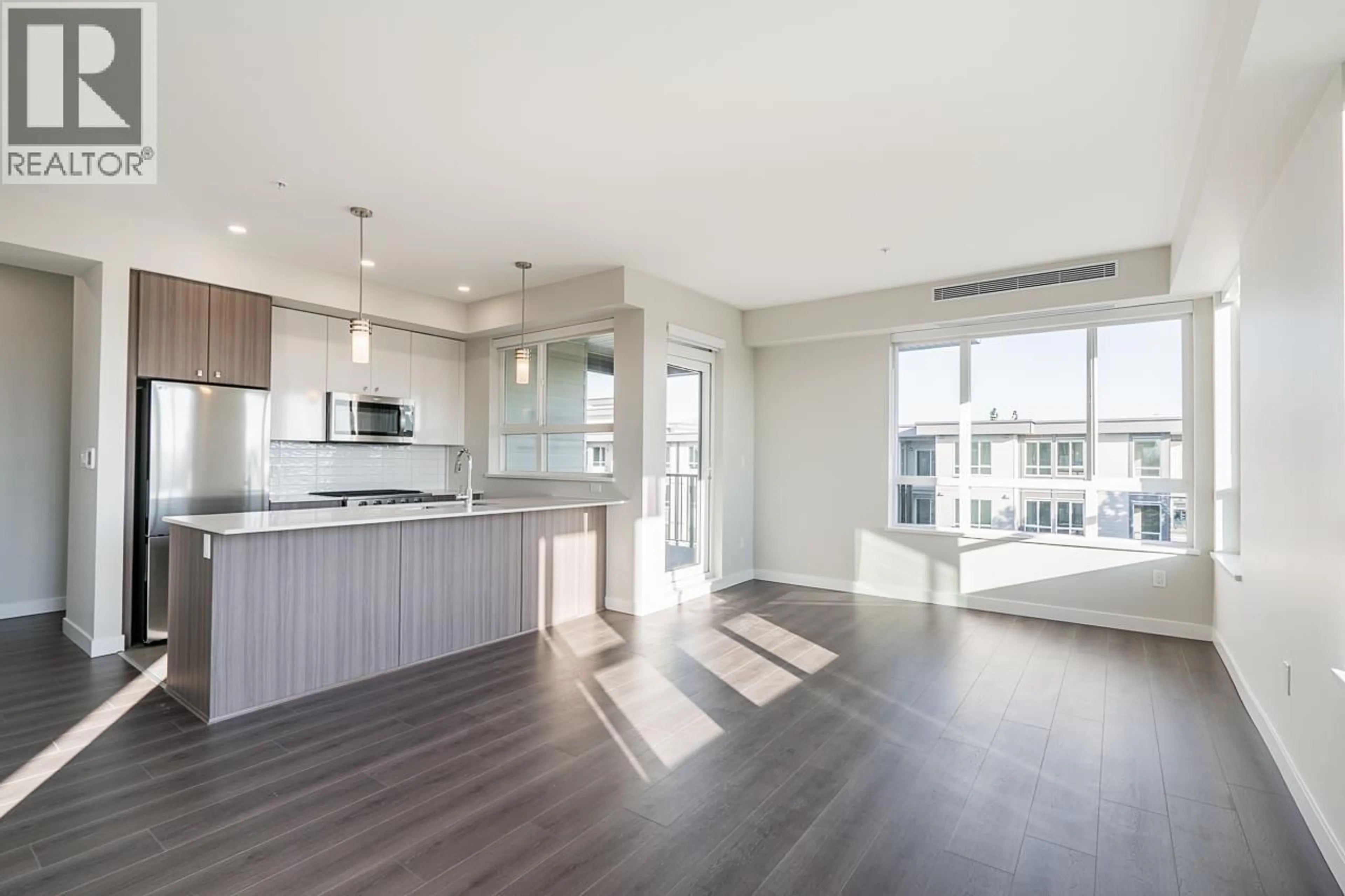 Open concept kitchen, wood/laminate floor for 431 - 23200 GILLEY ROAD, Richmond British Columbia V6V2L6