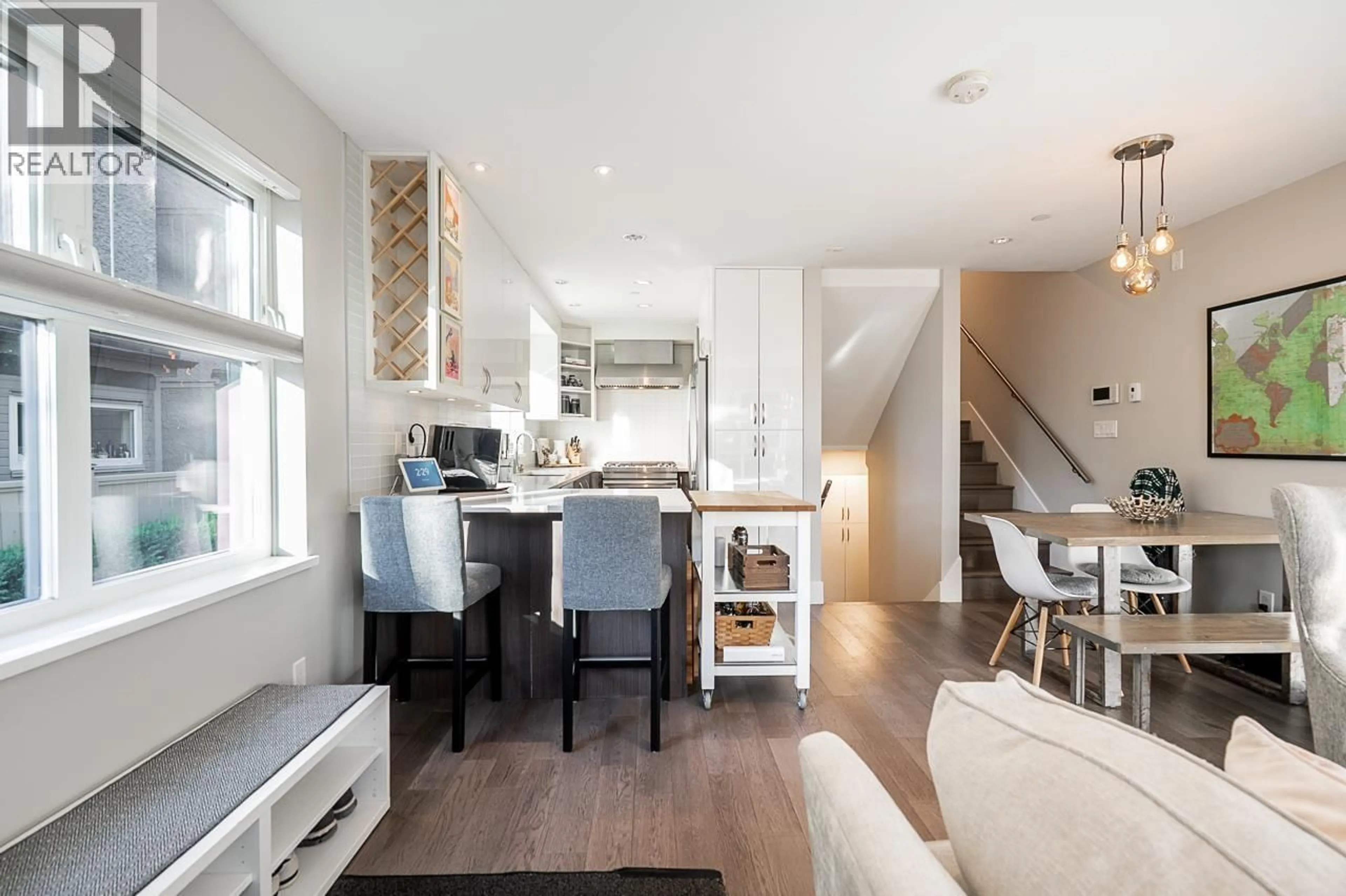 Open concept kitchen, wood/laminate floor for 1865 ADANAC STREET, Vancouver British Columbia V5L2E1