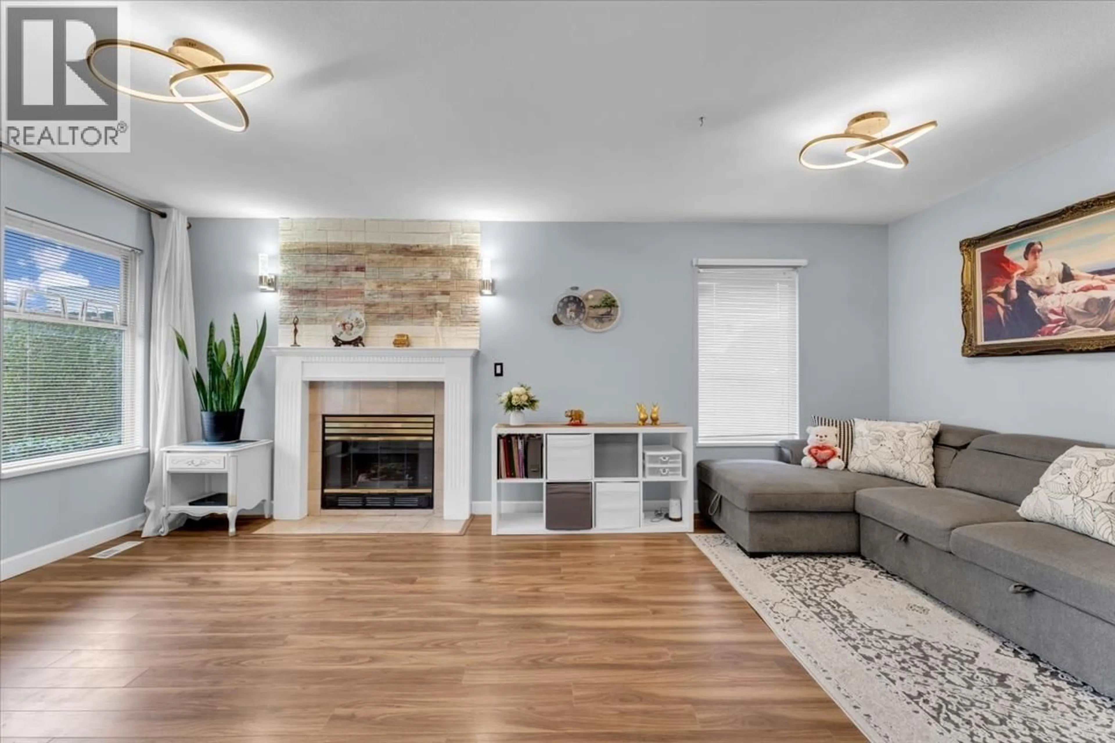 Living room with furniture, wood/laminate floor for 3 - 6675 NO. 2 ROAD, Richmond British Columbia V7C3L5