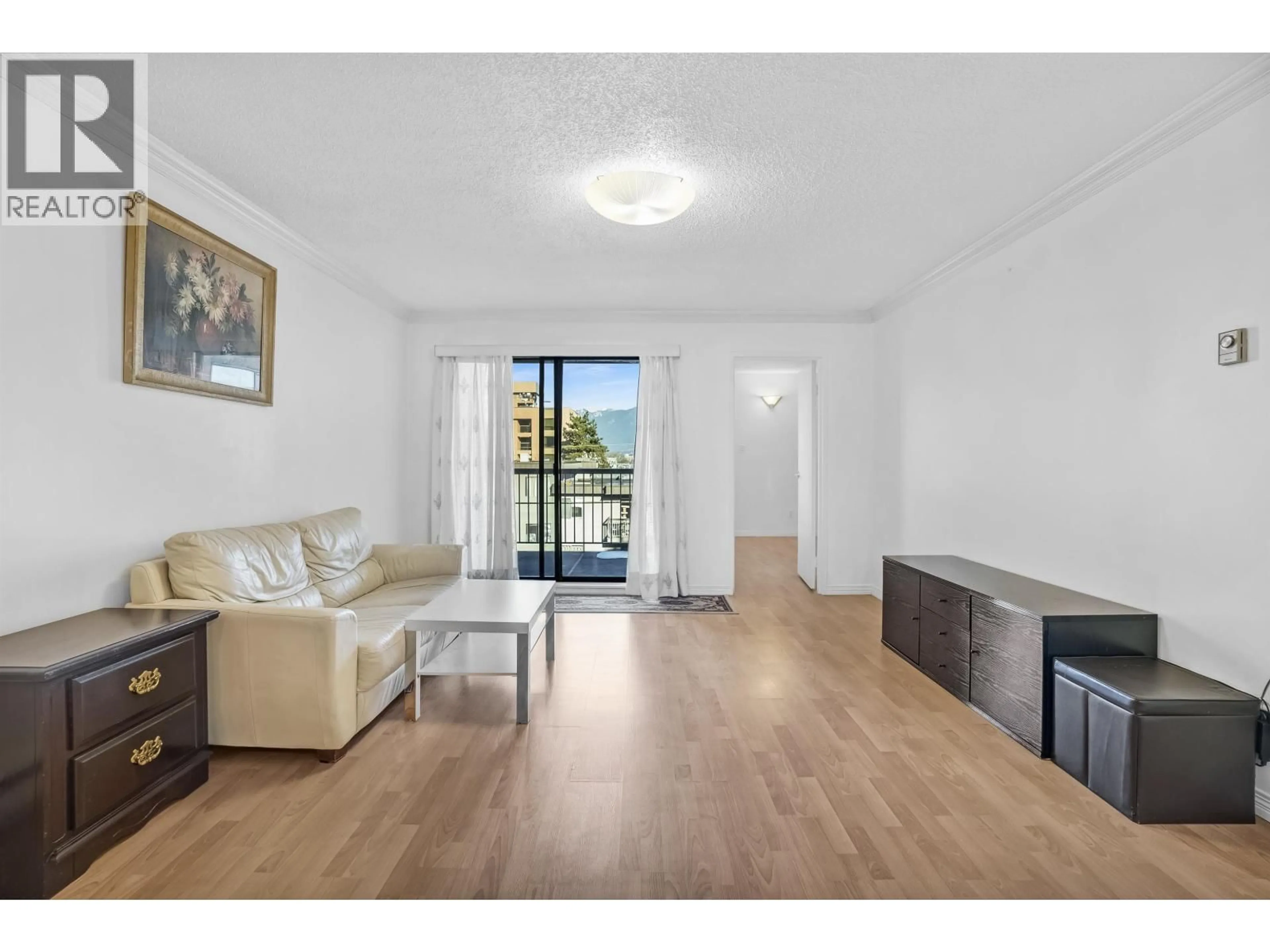 Living room with furniture, wood/laminate floor for 303 - 975 BROADWAY, Vancouver British Columbia V5T1Y3