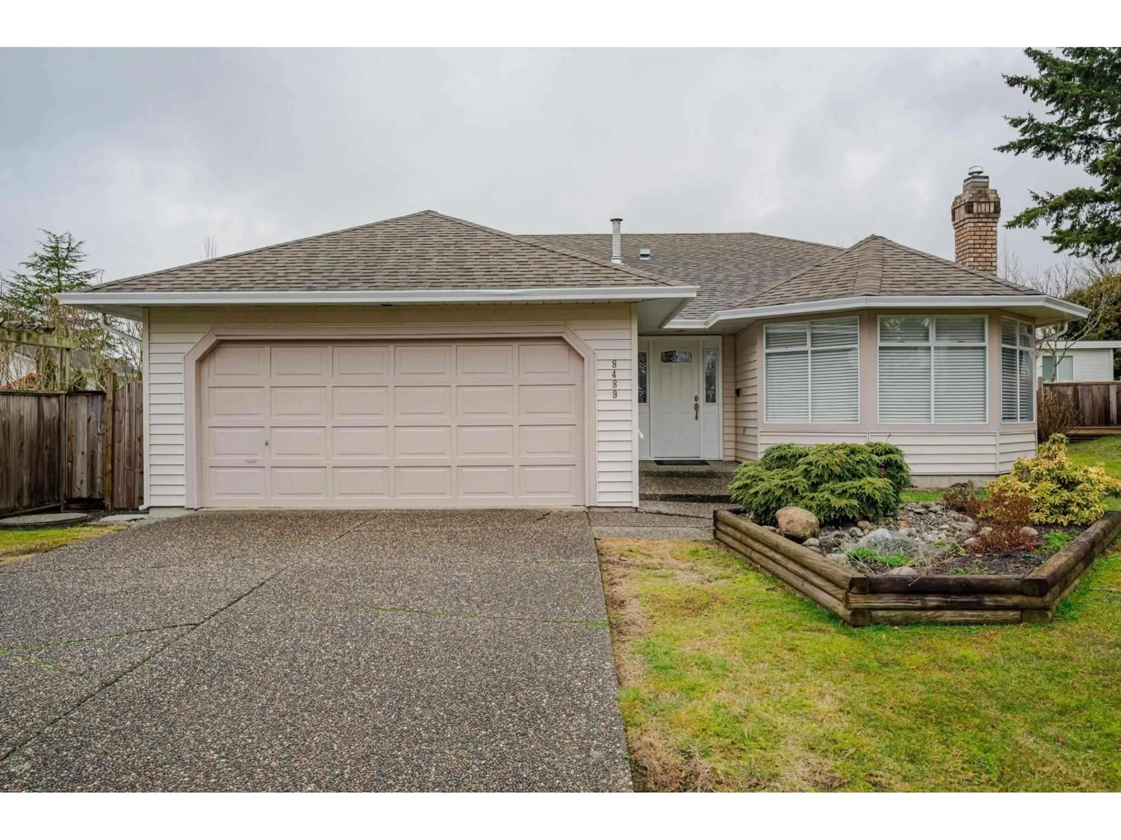 Home with vinyl exterior material, street for 8489 154A STREET, Surrey British Columbia V3S6H5