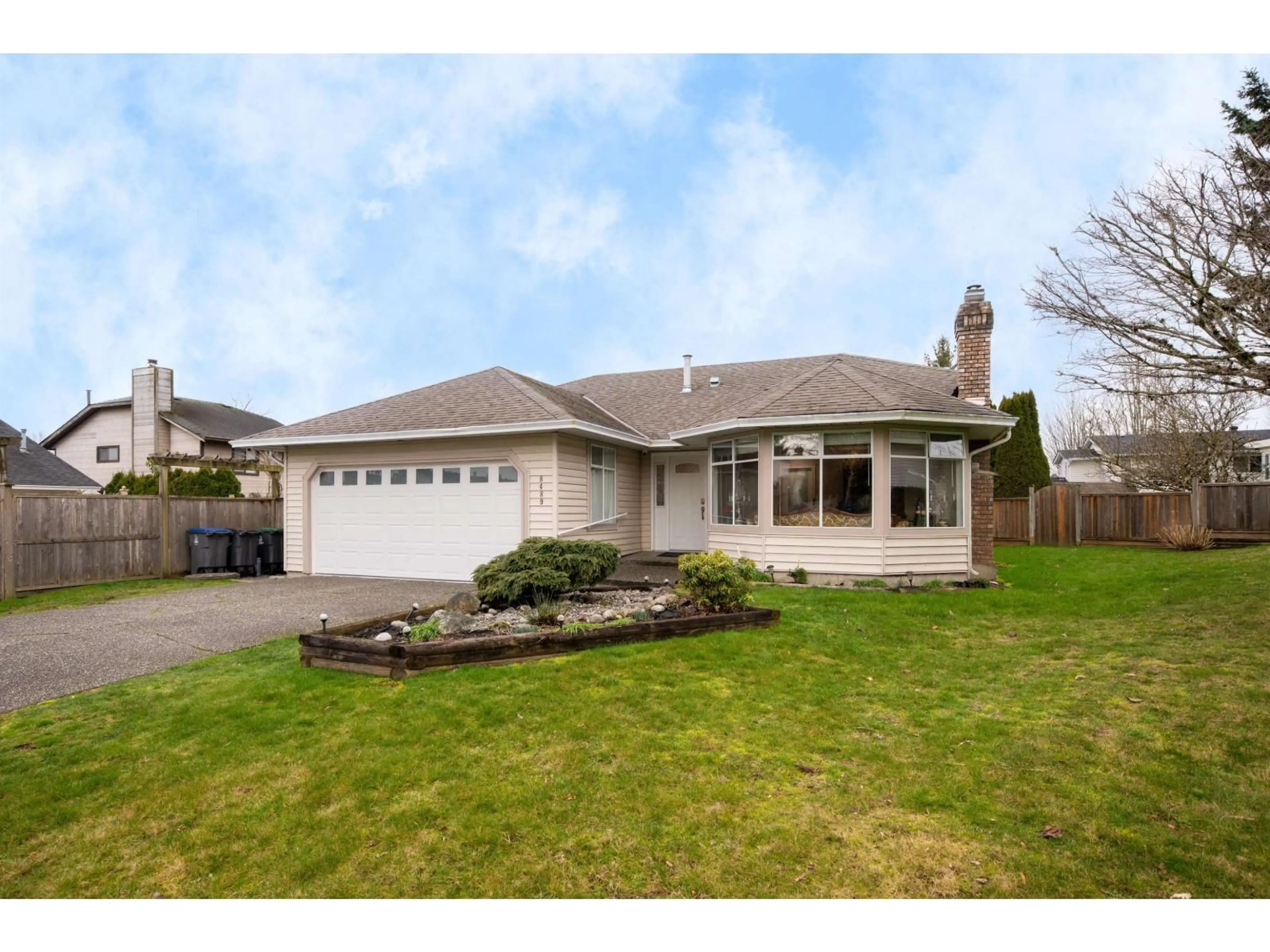 Home with vinyl exterior material, street for 8489 154A STREET, Surrey British Columbia V3S6H5