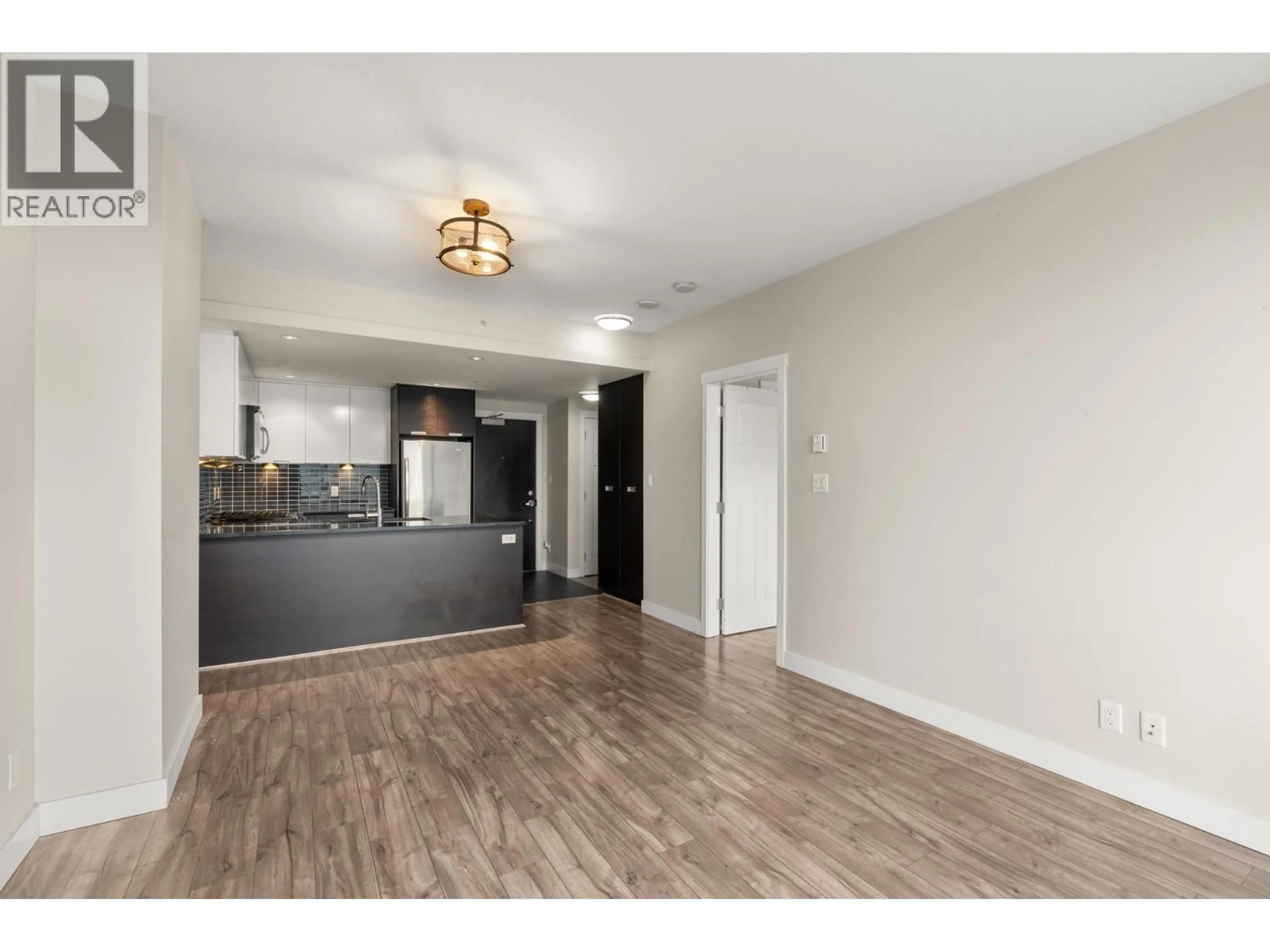 Open concept kitchen, wood/laminate floor for 802 - 2968 GLEN DRIVE, Coquitlam British Columbia V3B0C4