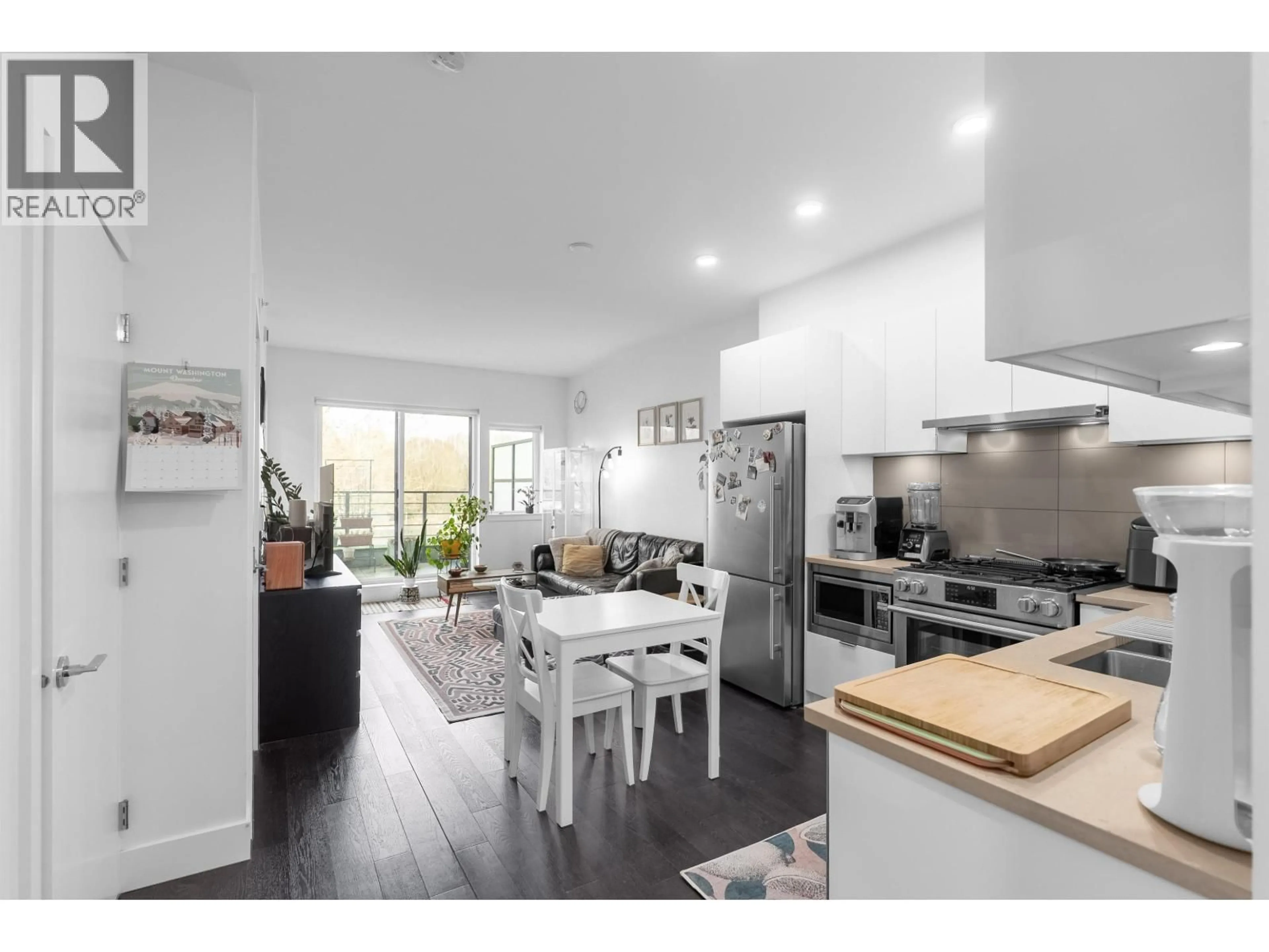 Open concept kitchen, wood/laminate floor for 405 - 2666 DUKE STREET, Vancouver British Columbia V5R4S9