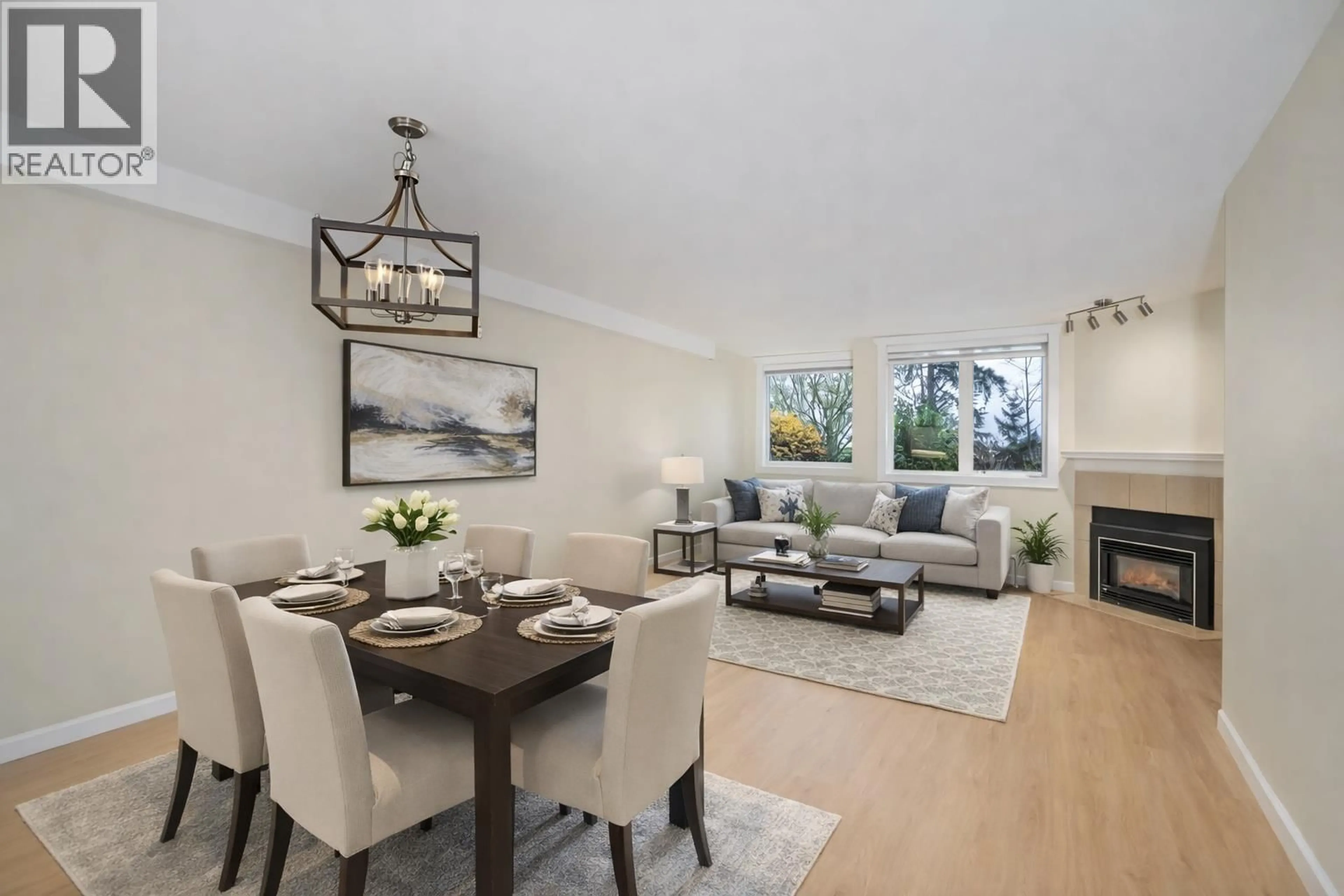 Living room with furniture, wood/laminate floor for 110 - 6707 SOUTHPOINT DRIVE, Burnaby British Columbia V3N4V8