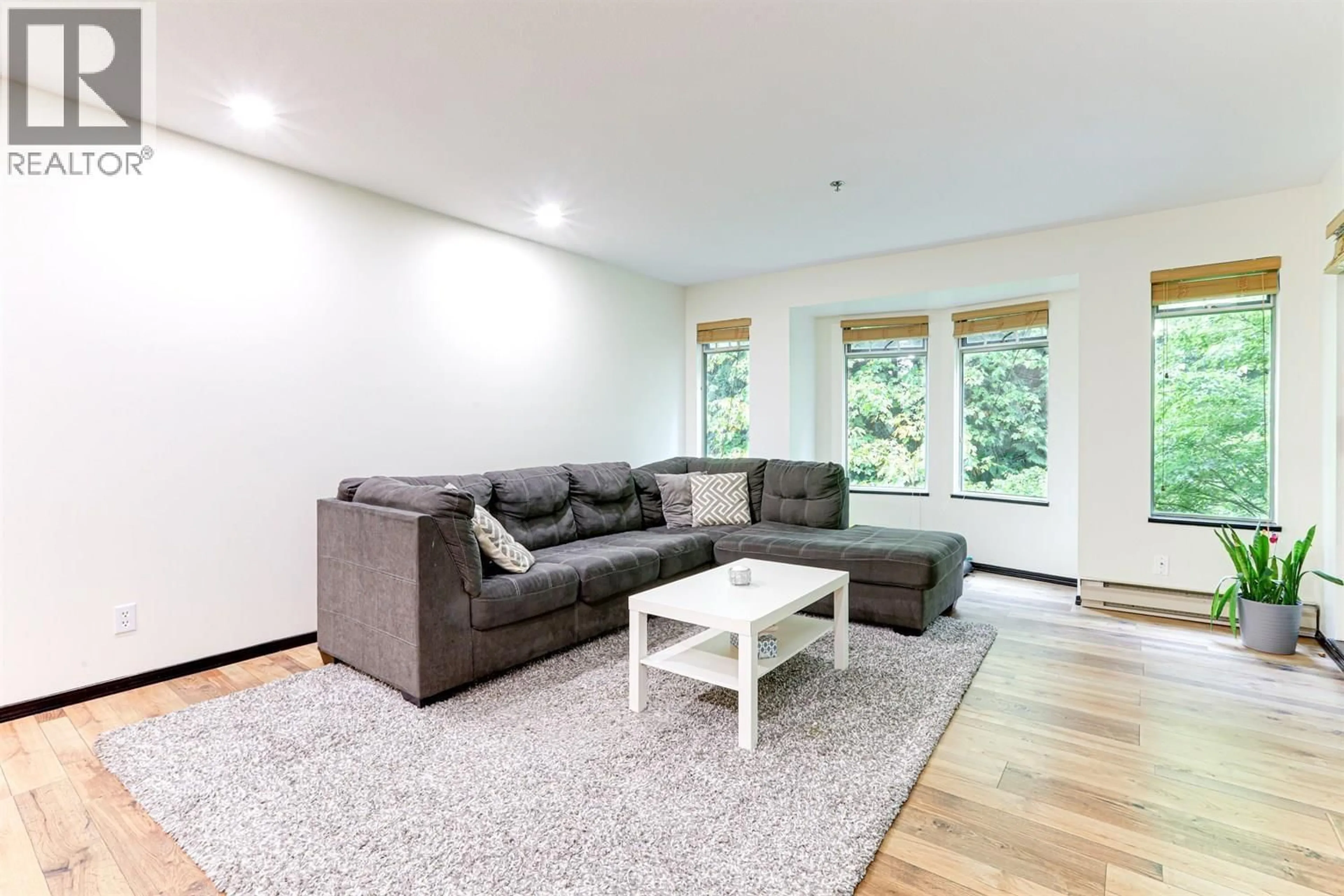 Living room with furniture, wood/laminate floor for 505 - 6737 STATION HILL COURT, Burnaby British Columbia V3N4V2