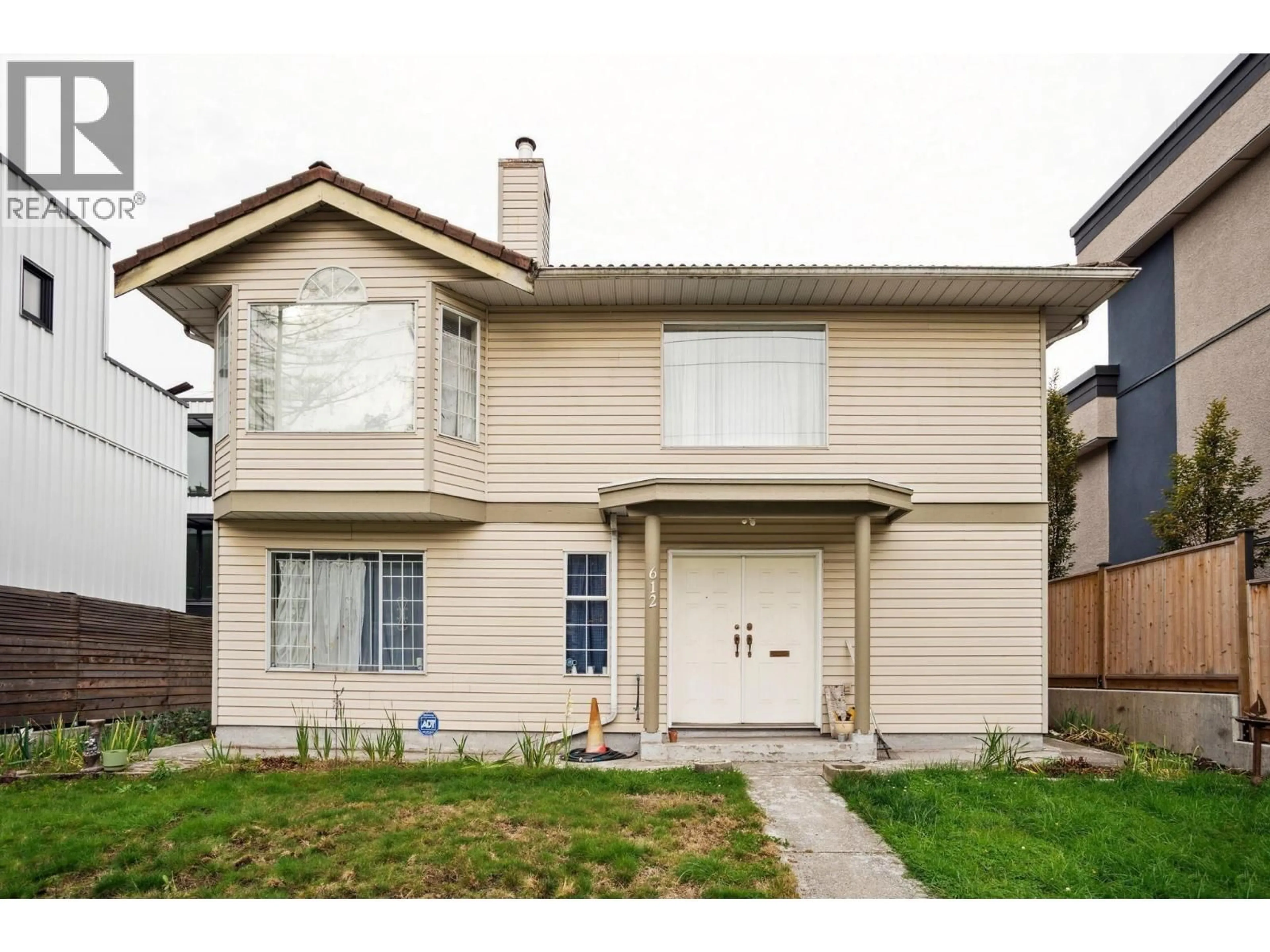 Home with vinyl exterior material, street for 612 3RD STREET, North Vancouver British Columbia V7L1G7