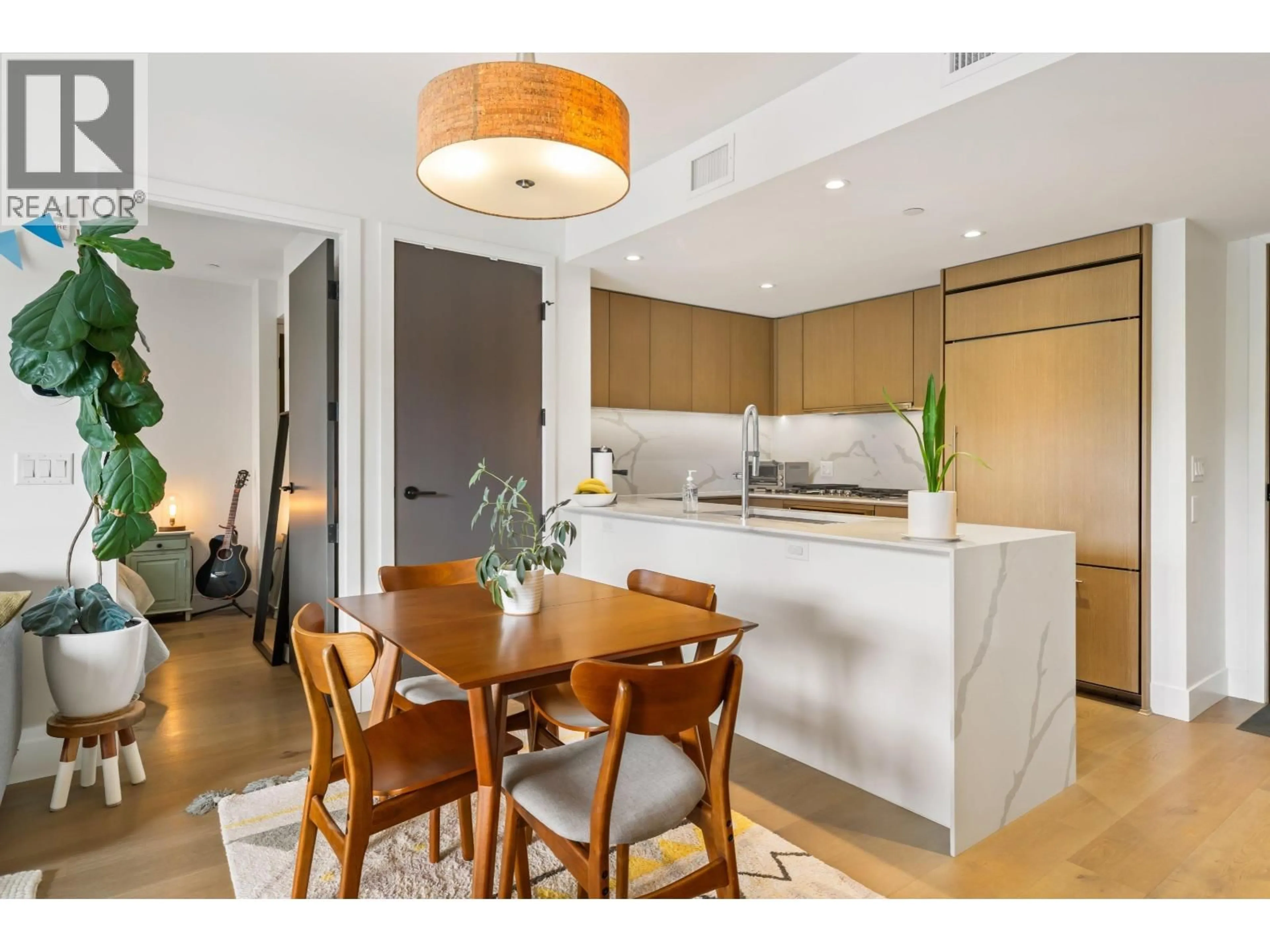 Open concept kitchen, wood/laminate floor for 201 - 5089 QUEBEC STREET, Vancouver British Columbia V5W0E5