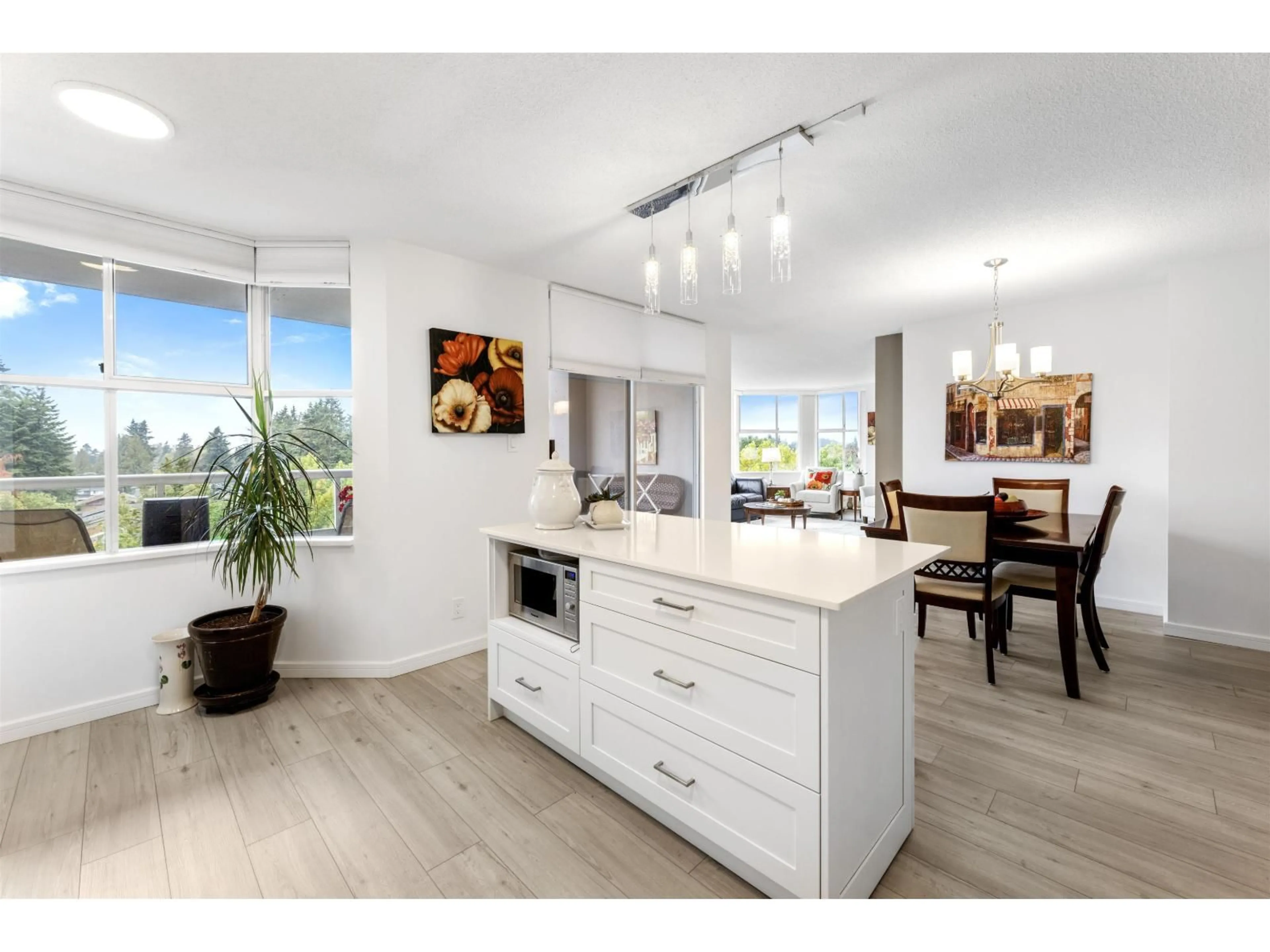 Open concept kitchen, wood/laminate floor for 801 - 11910 80 AVENUE, Delta British Columbia V4C8E3