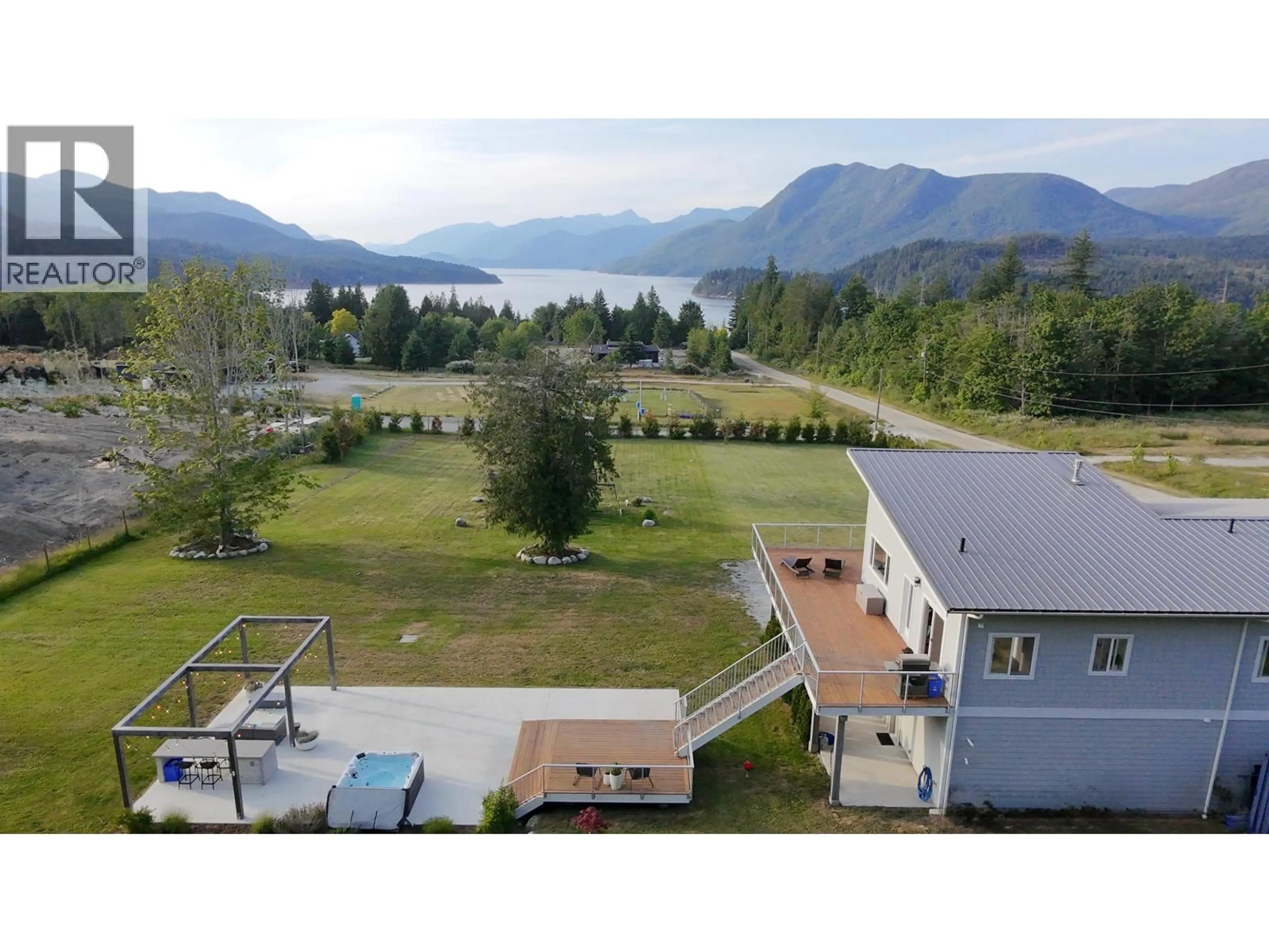 A pic from outside/outdoor area/front of a property/back of a property/a pic from drone, water/lake/river/ocean view for 6315 RIMROCK ROAD, Sechelt British Columbia V7Z0L1