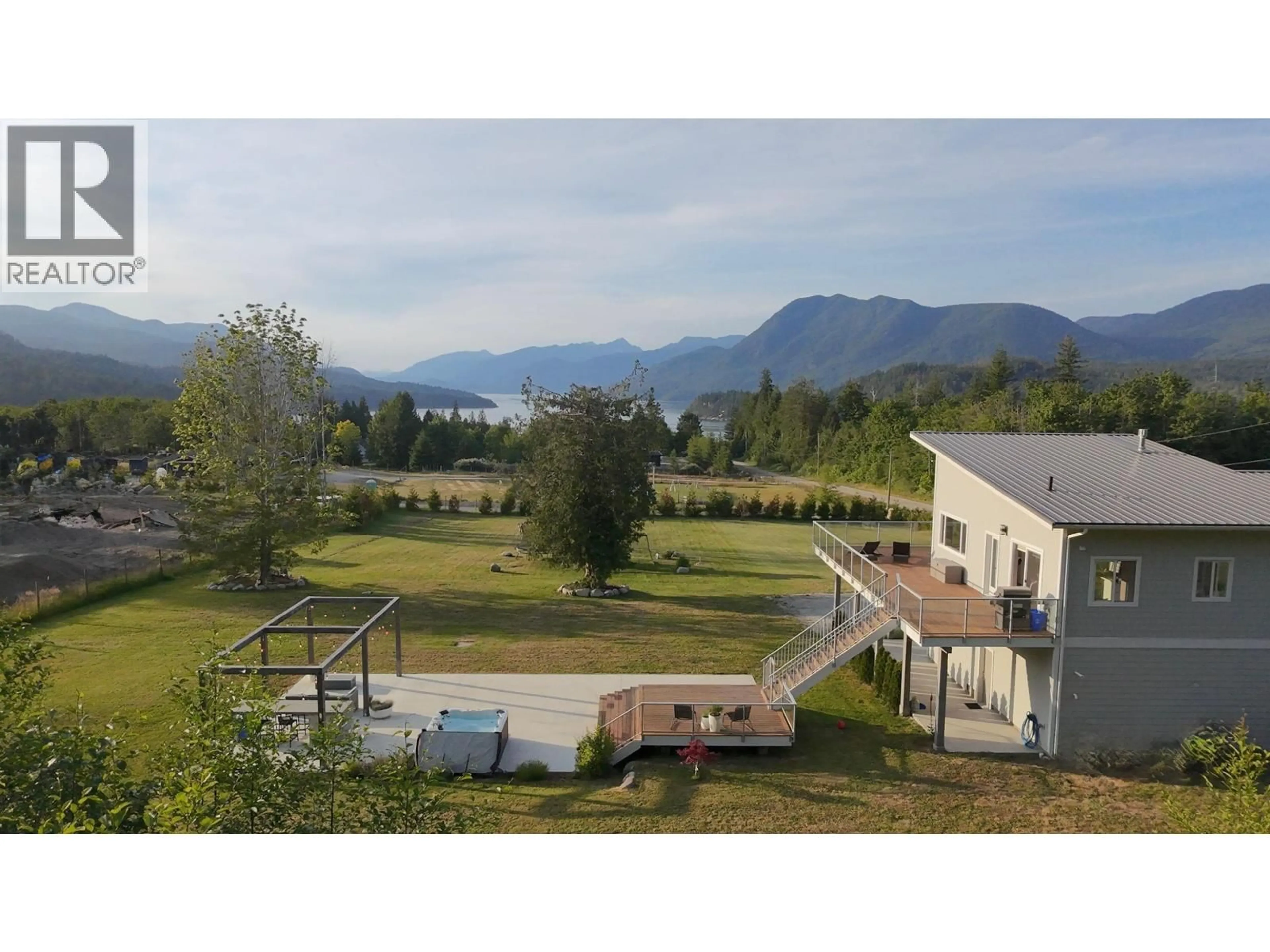 A pic from outside/outdoor area/front of a property/back of a property/a pic from drone, mountain view for 6315 RIMROCK ROAD, Sechelt British Columbia V7Z0L1