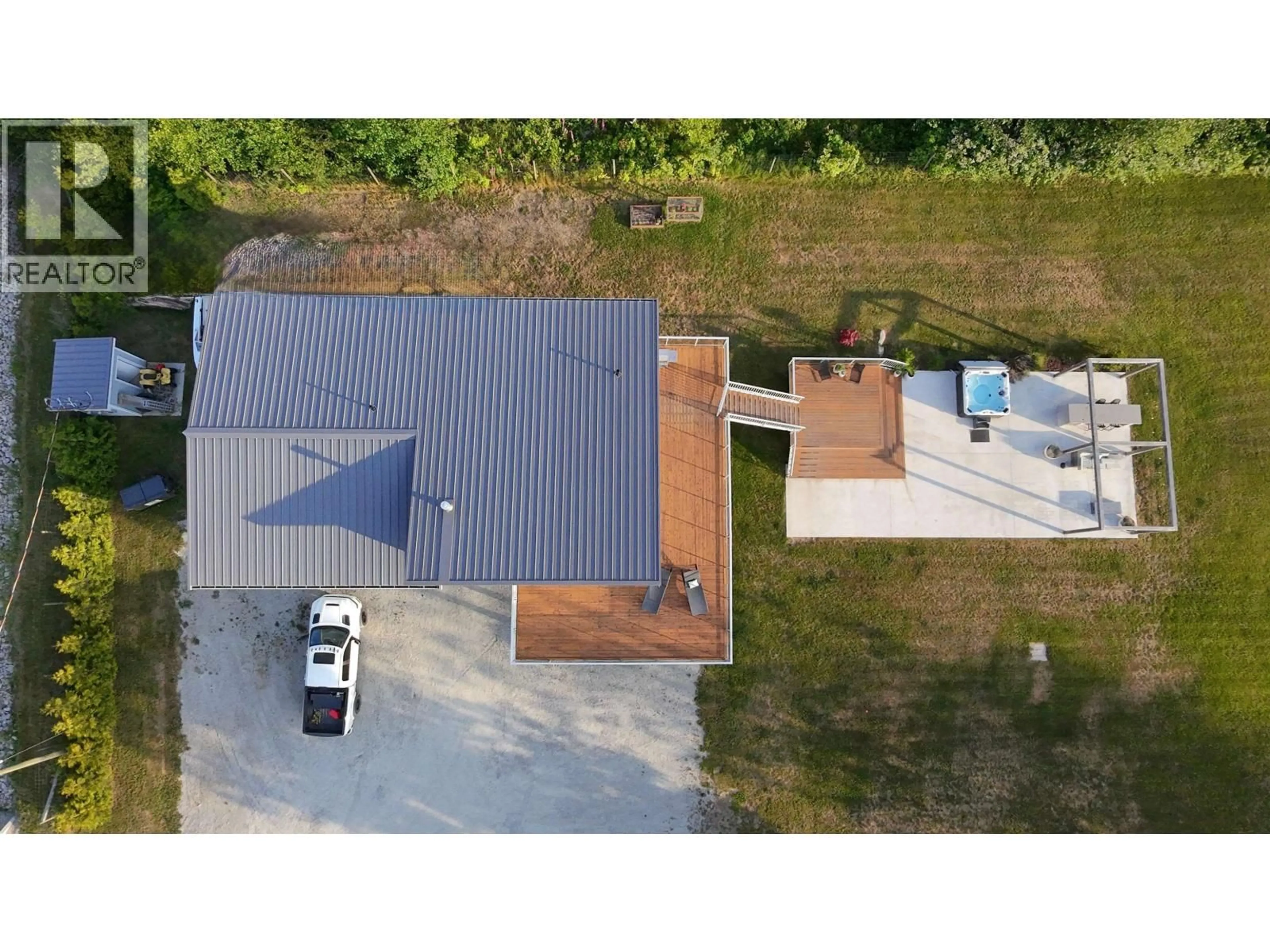 A pic from outside/outdoor area/front of a property/back of a property/a pic from drone, street for 6315 RIMROCK ROAD, Sechelt British Columbia V7Z0L1