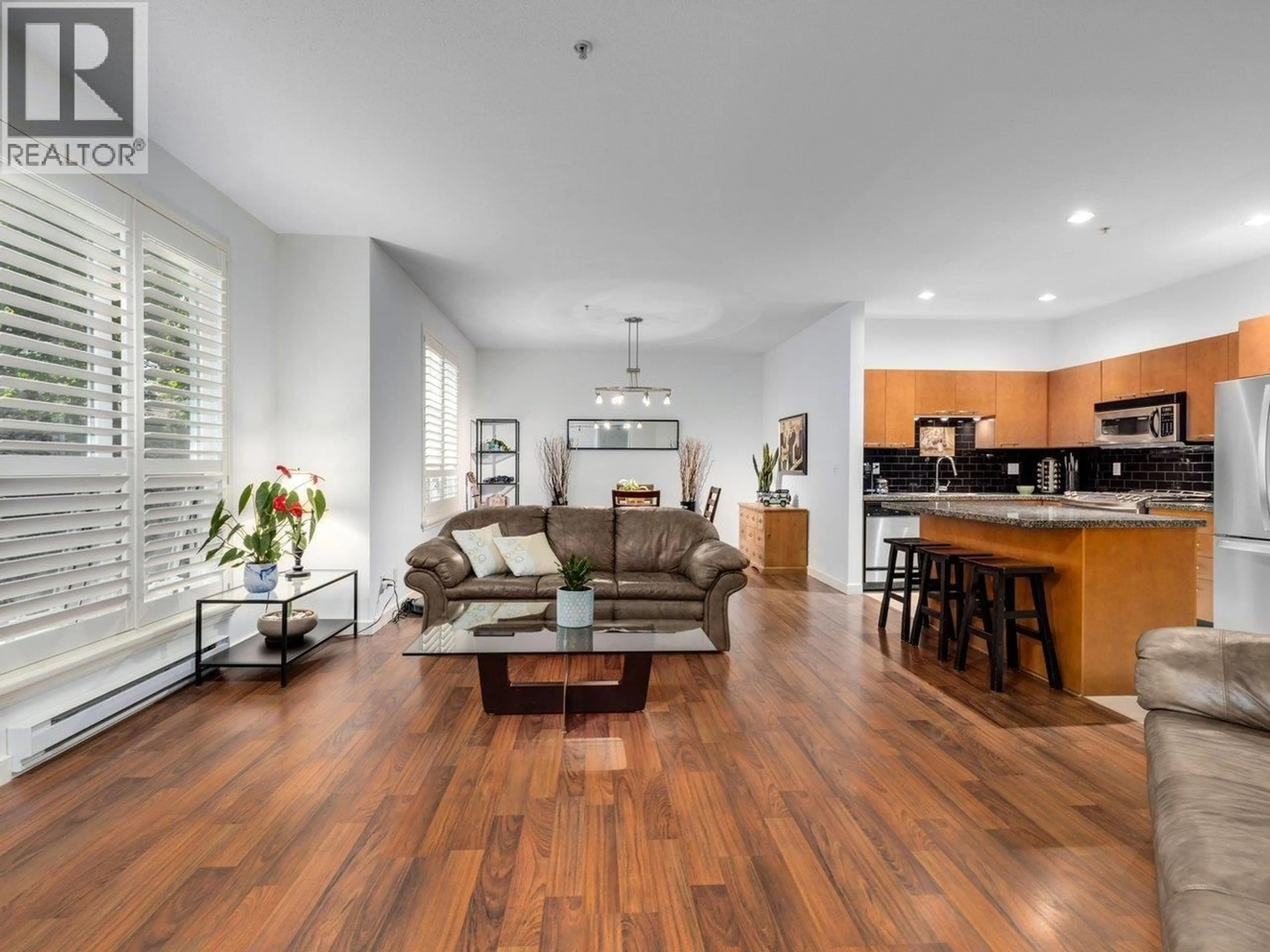 Living room with furniture, wood/laminate floor for 207 - 1175 55 STREET, Tsawwassen British Columbia V4M3J9