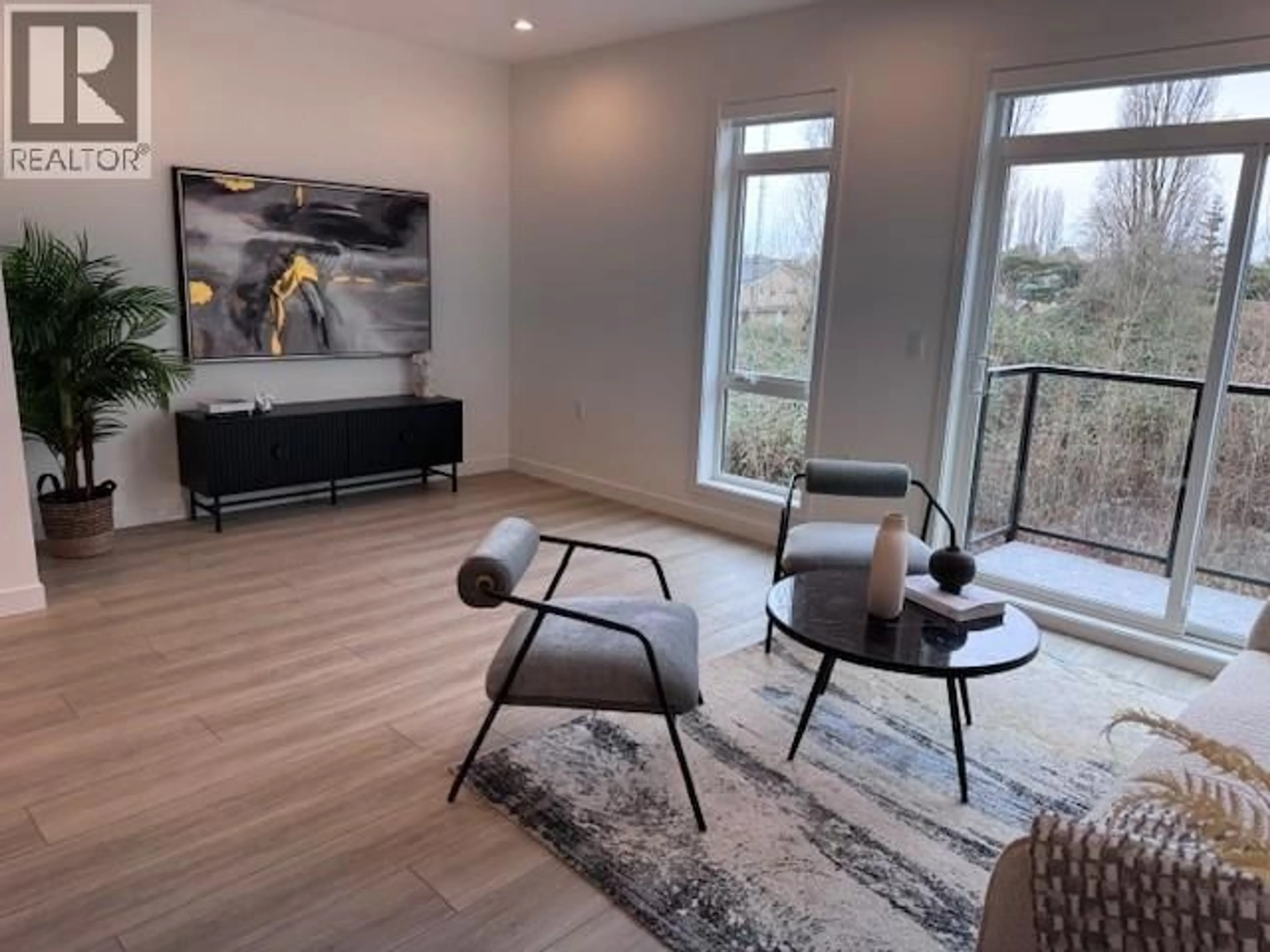Living room with furniture, wood/laminate floor for 14 - 4337 BOUNDARY ROAD, Richmond British Columbia V6V0C4