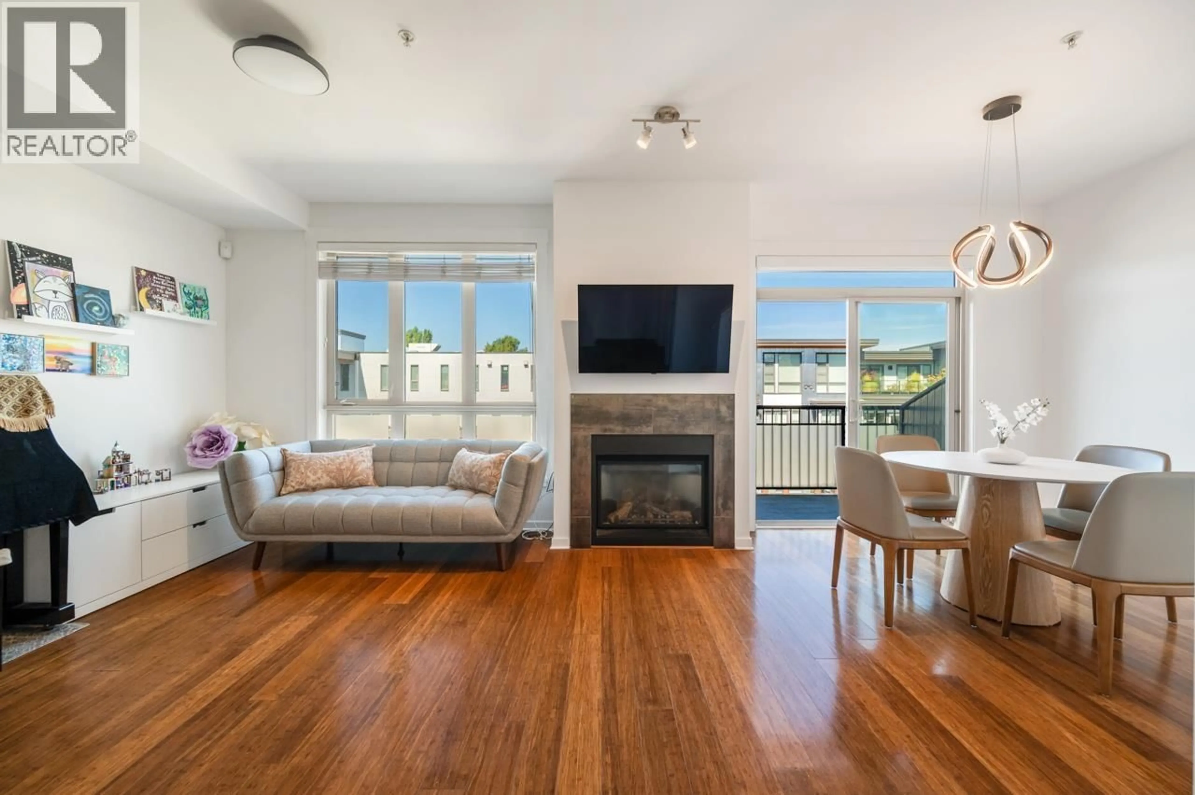 Living room with furniture, wood/laminate floor for 304 - 6077 LONDON ROAD, Richmond British Columbia V7E0A7