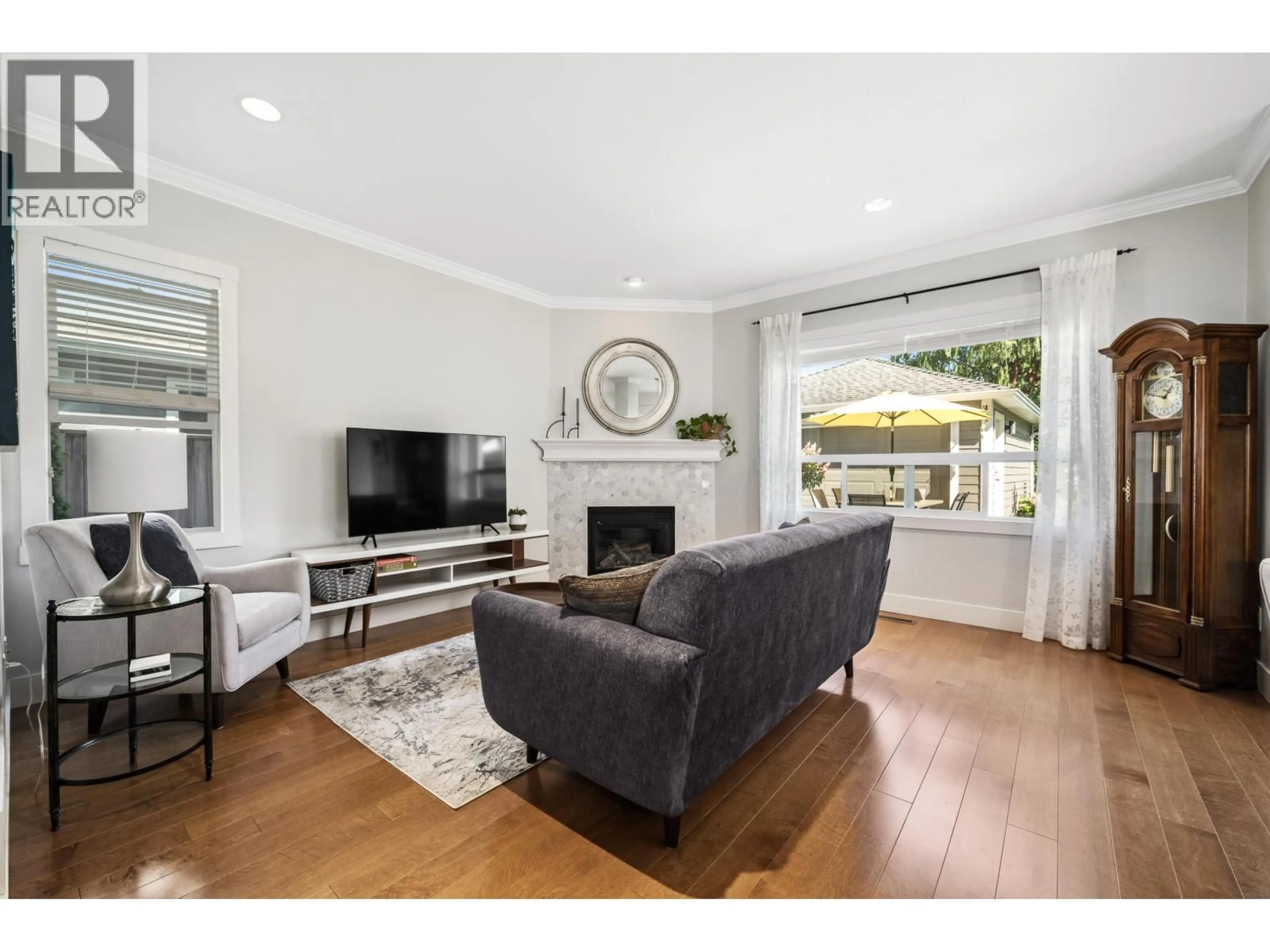 Living room with furniture, wood/laminate floor for 5158 WESTMINSTER LANE, Delta British Columbia V4K5G3
