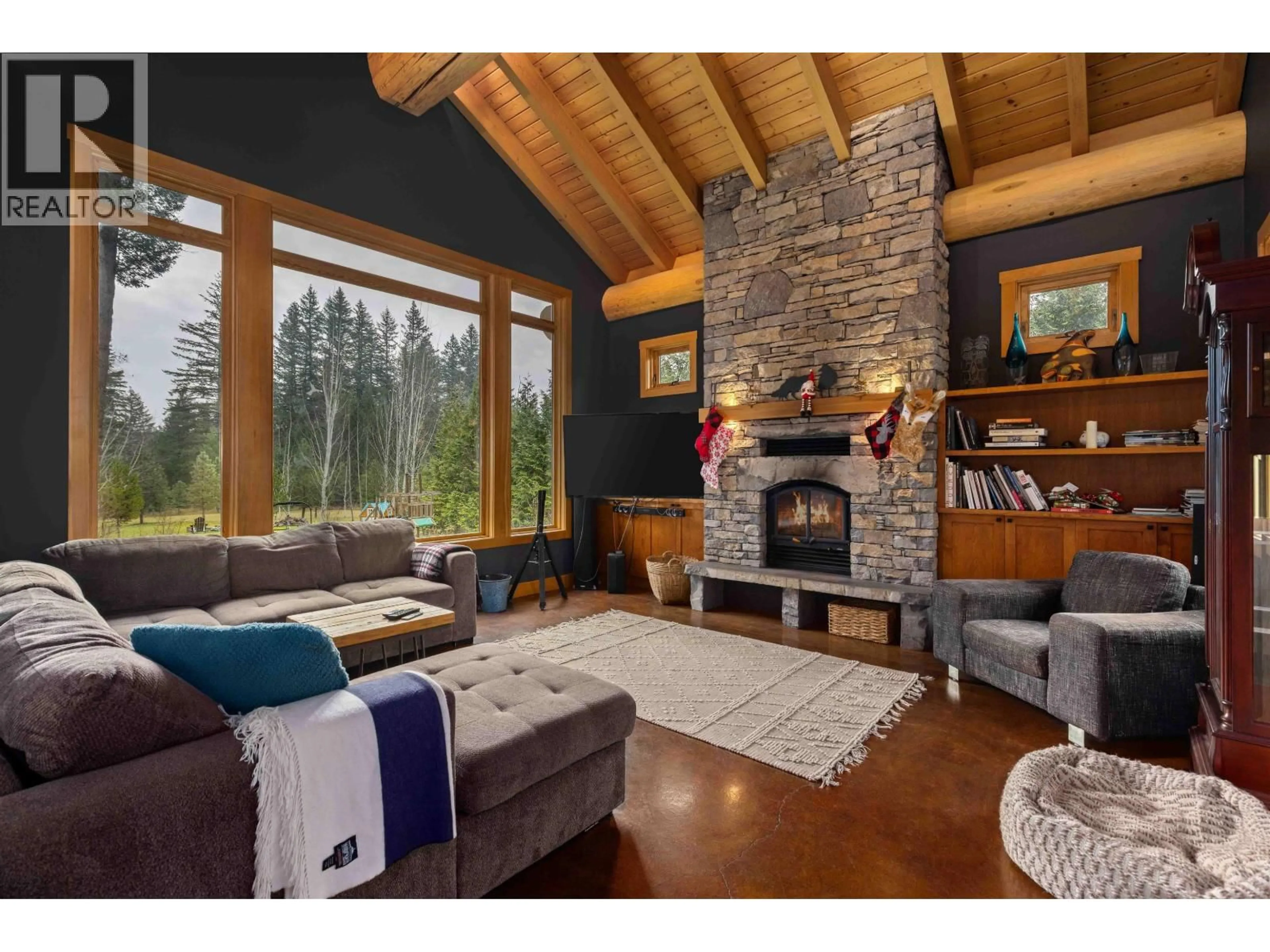 Living room with furniture, wood/laminate floor for 7703 PEMBERTON PORTAGE ROAD, Pemberton British Columbia V0N2L0