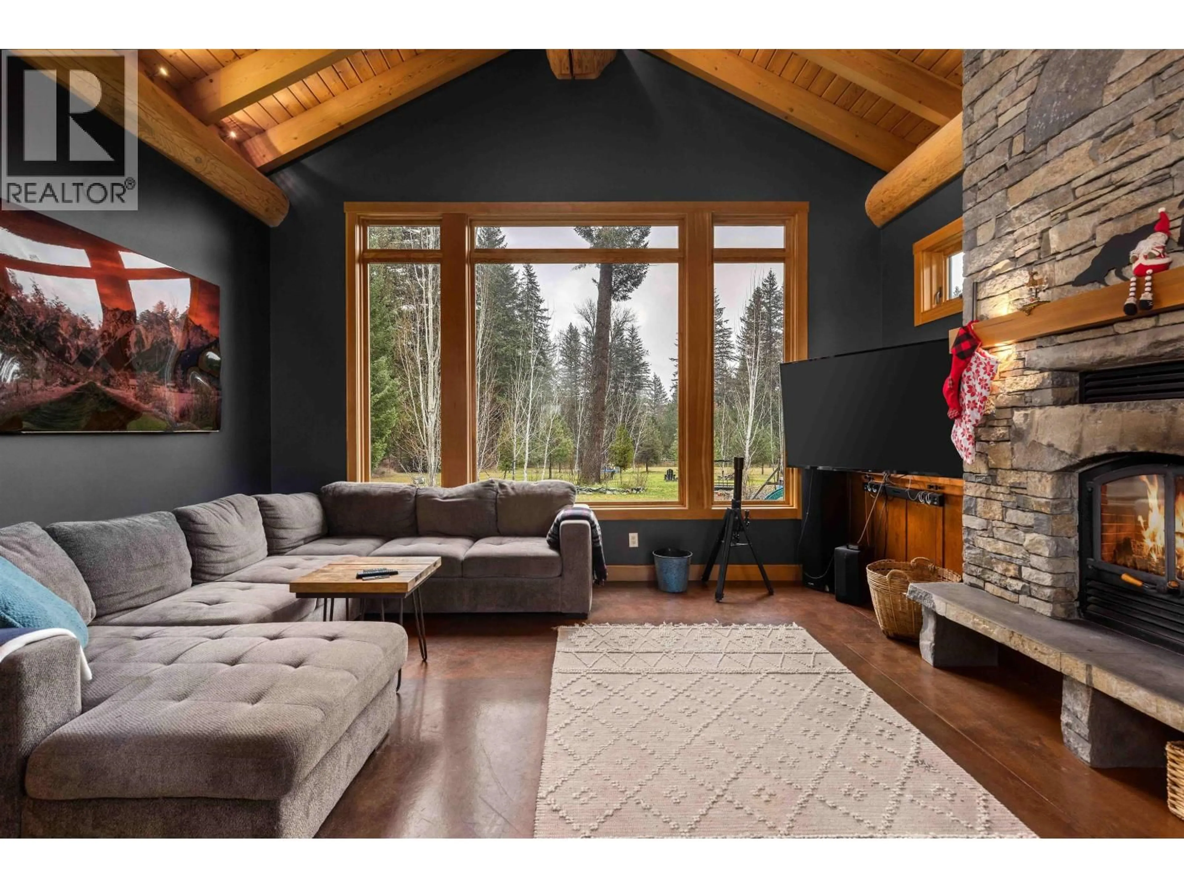 Living room with furniture, wood/laminate floor for 7703 PEMBERTON PORTAGE ROAD, Pemberton British Columbia V0N2L0