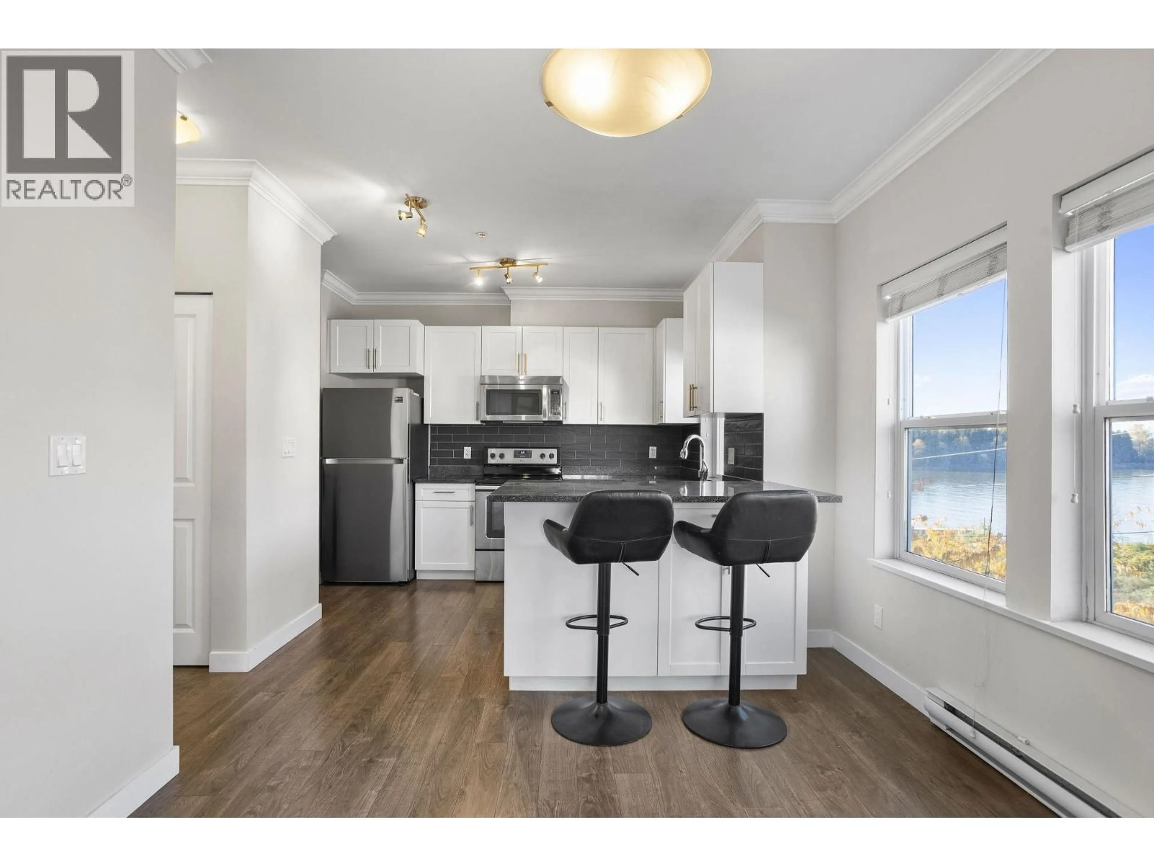 Open concept kitchen, wood/laminate floor for 301 - 11580 223 STREET, Maple Ridge British Columbia V2X9H1