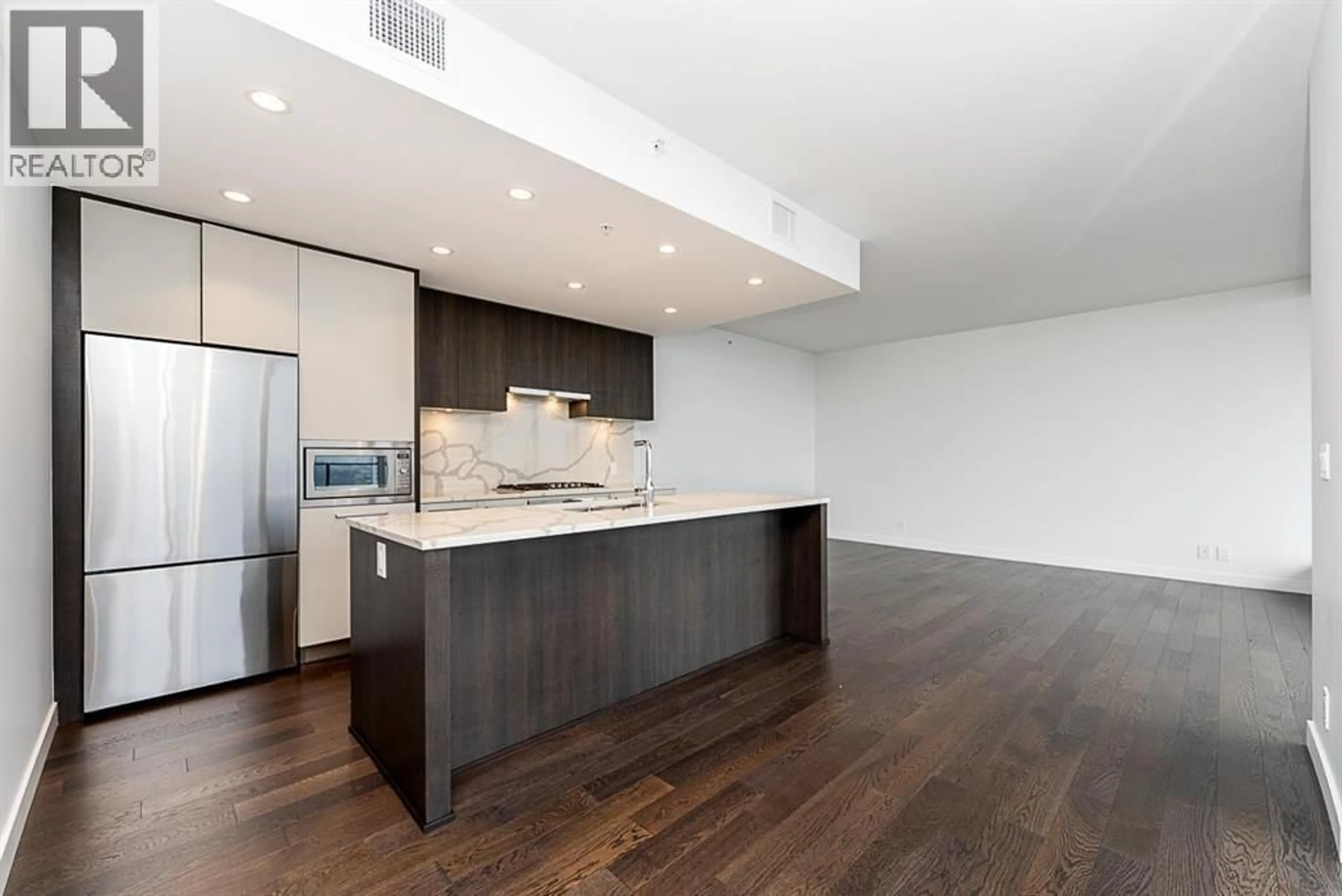 Open concept kitchen, wood/laminate floor for 4601 - 567 CLARKE ROAD, Coquitlam British Columbia V3J0K7