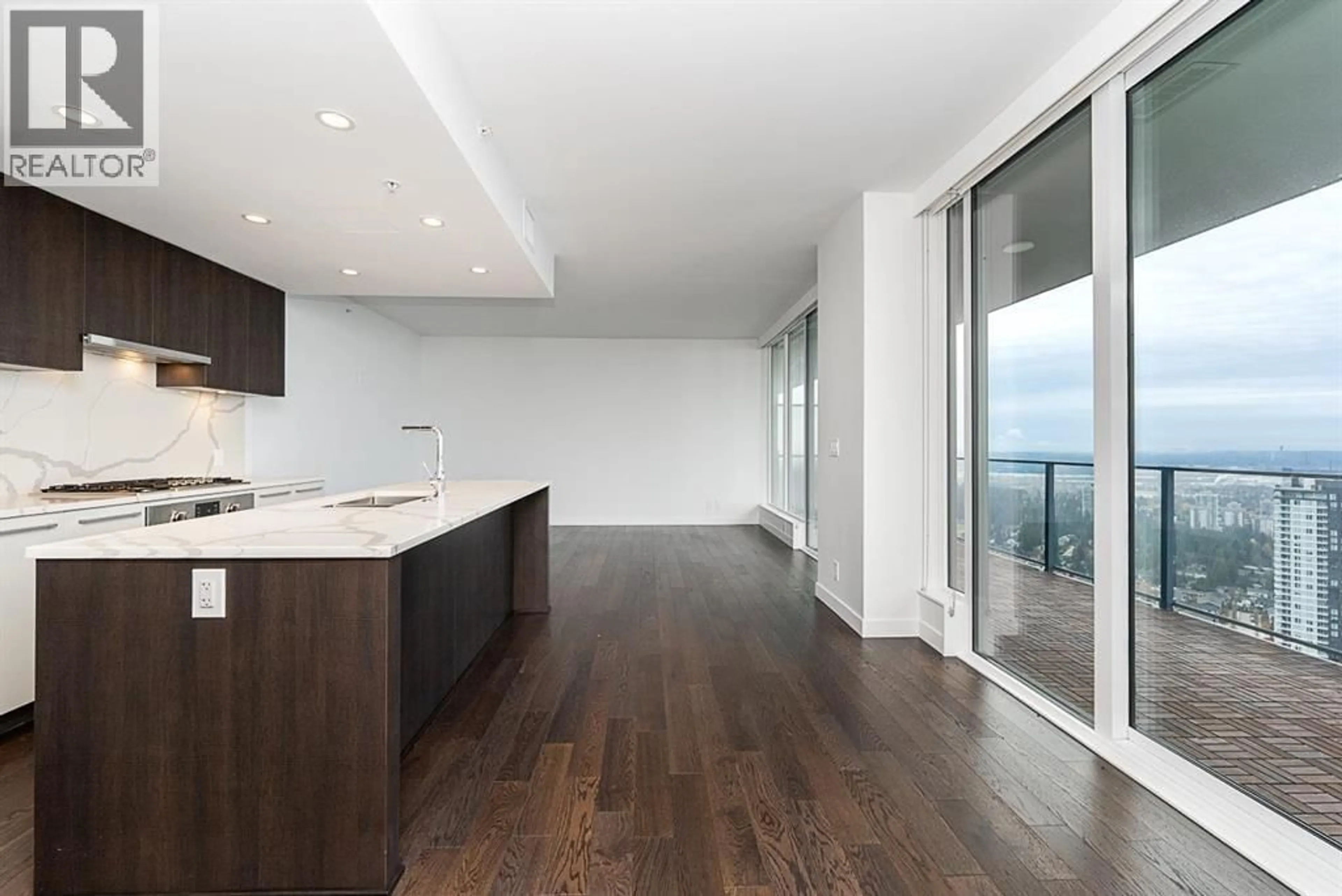 Open concept kitchen, wood/laminate floor for 4601 - 567 CLARKE ROAD, Coquitlam British Columbia V3J0K7