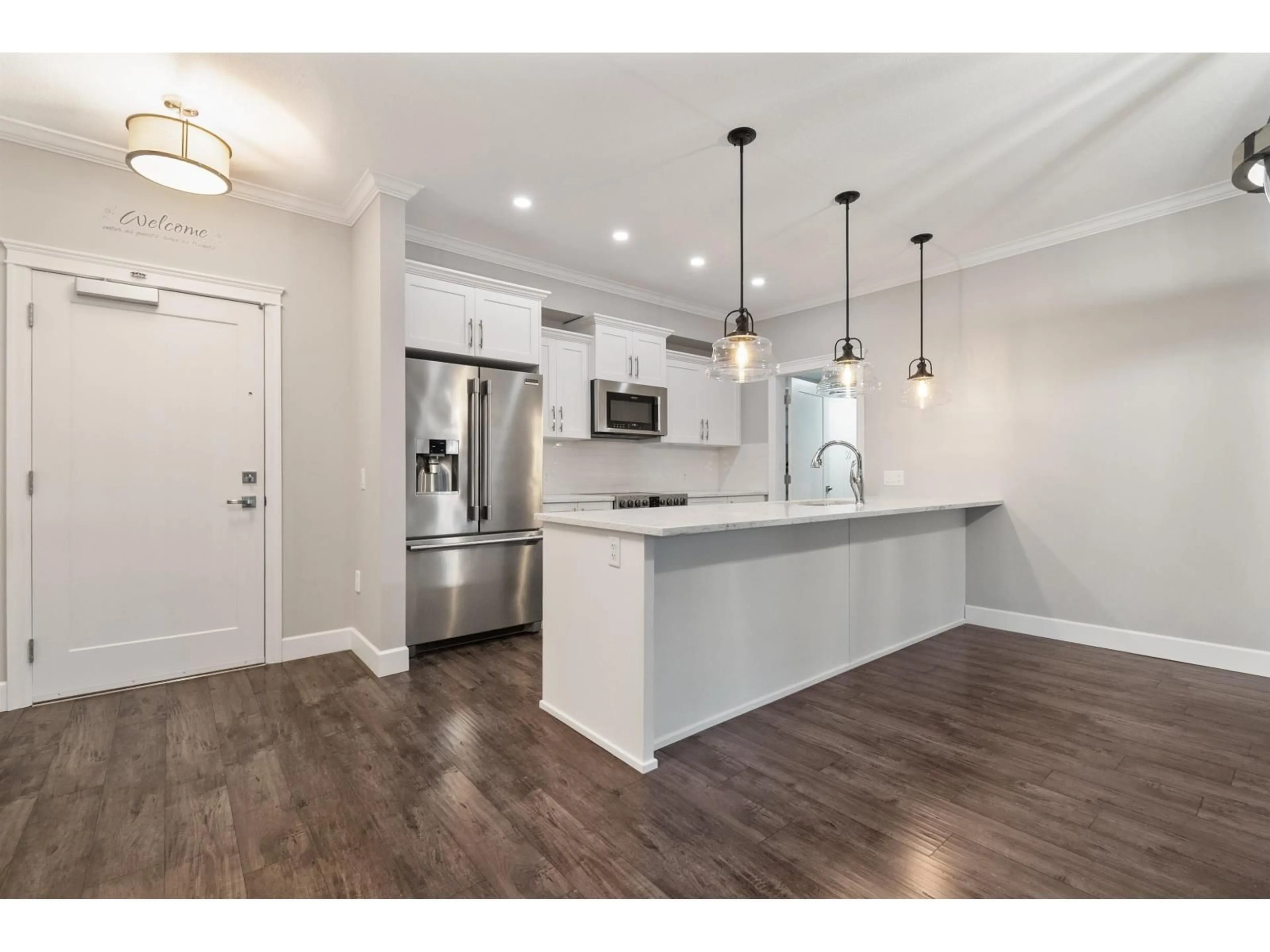 Open concept kitchen, wood/laminate floor for 108 - 45754 KEITH WILSON ROAD, Chilliwack British Columbia V2R6A9