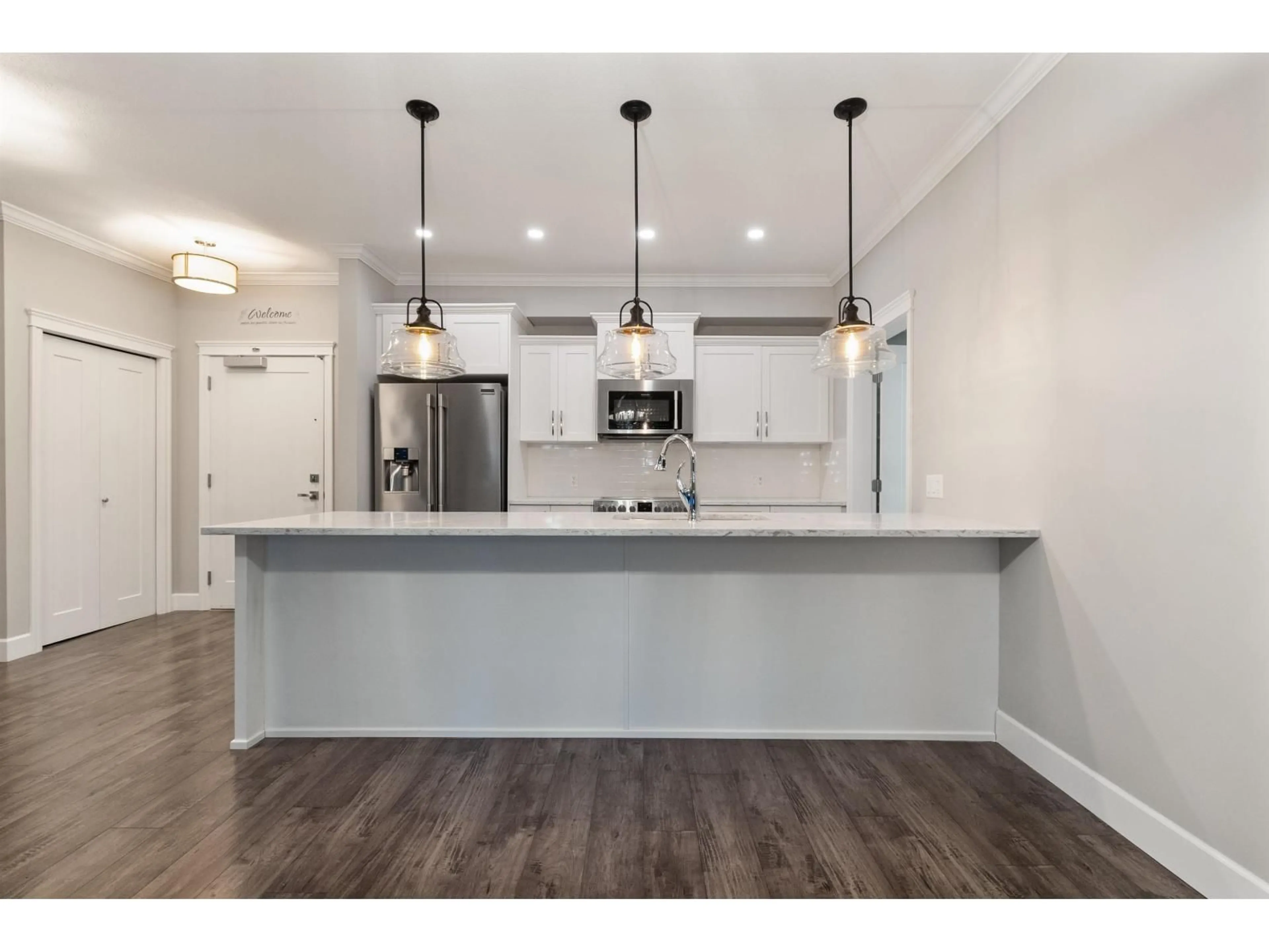 Open concept kitchen, wood/laminate floor for 108 - 45754 KEITH WILSON ROAD, Chilliwack British Columbia V2R6A9