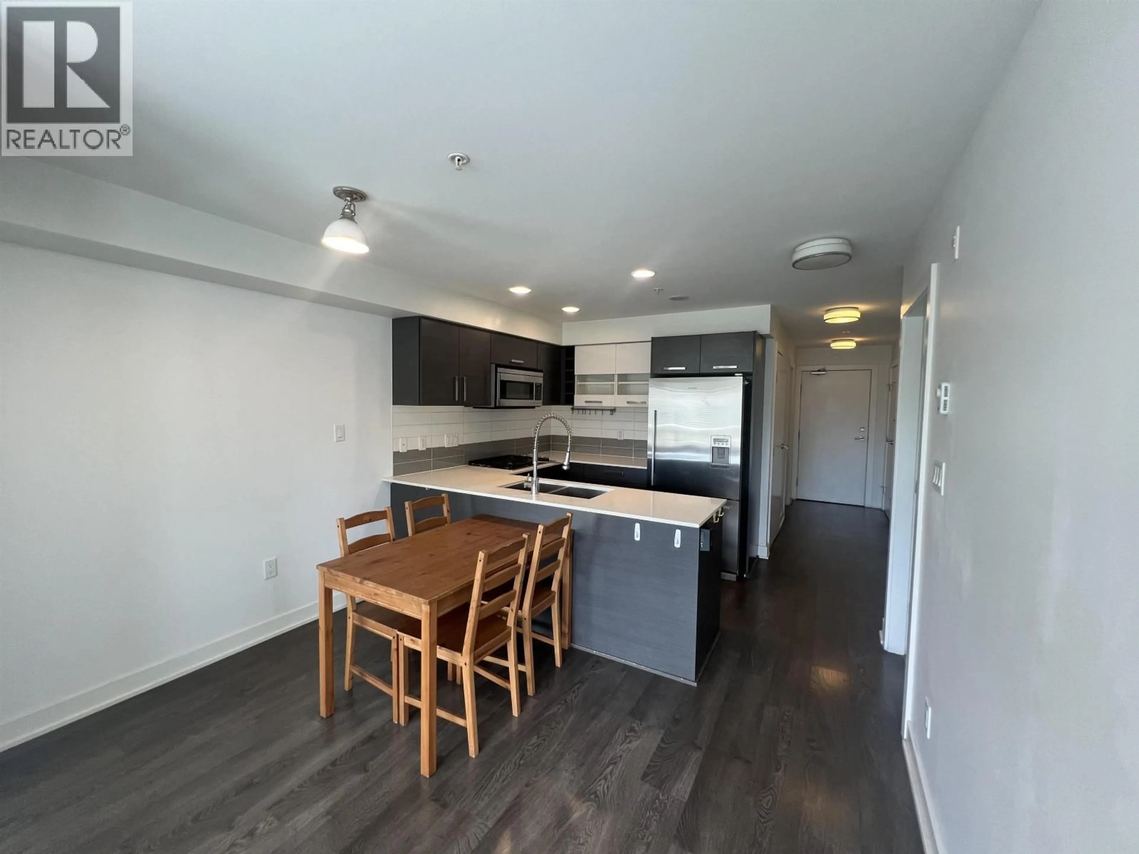 Open concept kitchen, wood/laminate floor for 307 - 2858 4TH AVENUE, Vancouver British Columbia V6K1R2