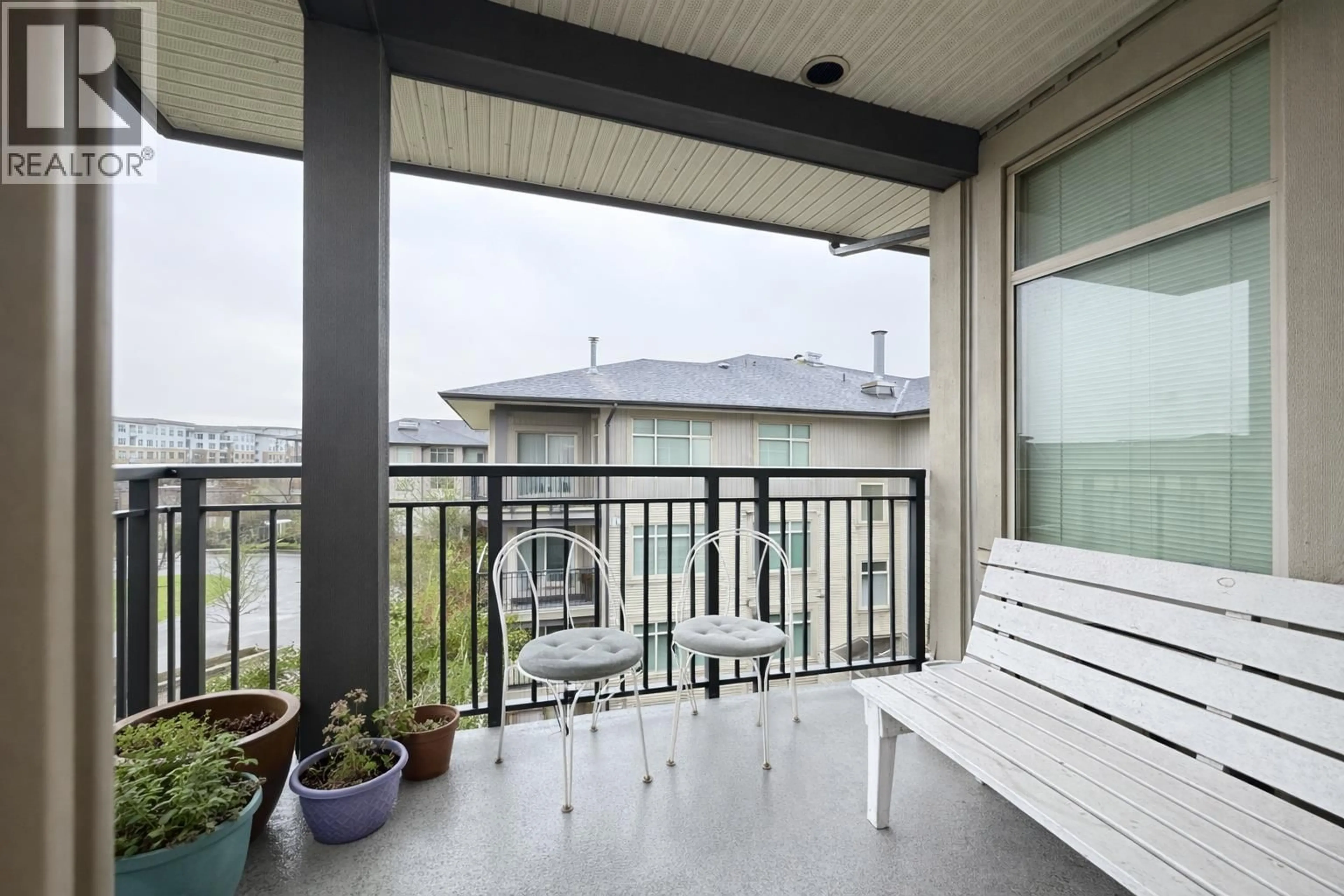 Balcony in the apartment, city buildings view from balcony for 410 - 9288 ODLIN ROAD, Richmond British Columbia V6X0C3
