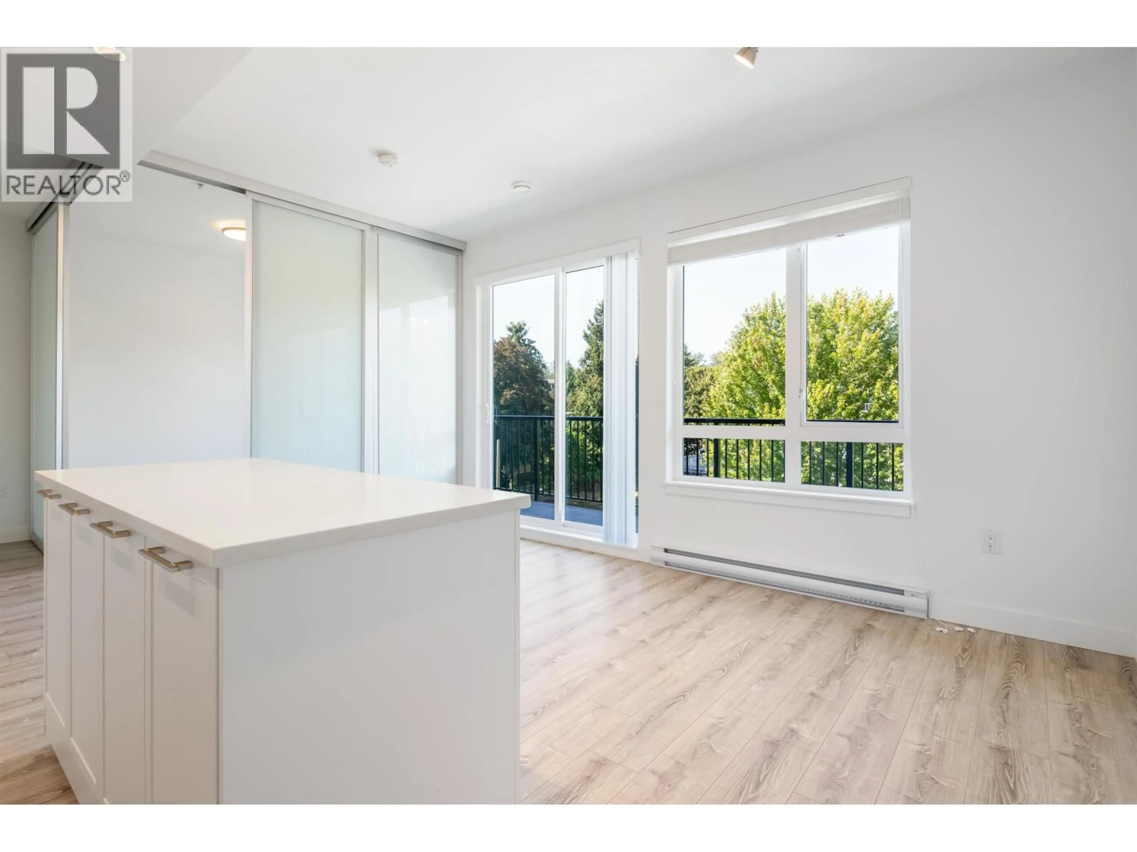 Open concept kitchen, wood/laminate floor for 407 - 2382 ATKINS AVENUE, Port Coquitlam British Columbia V3C0G7