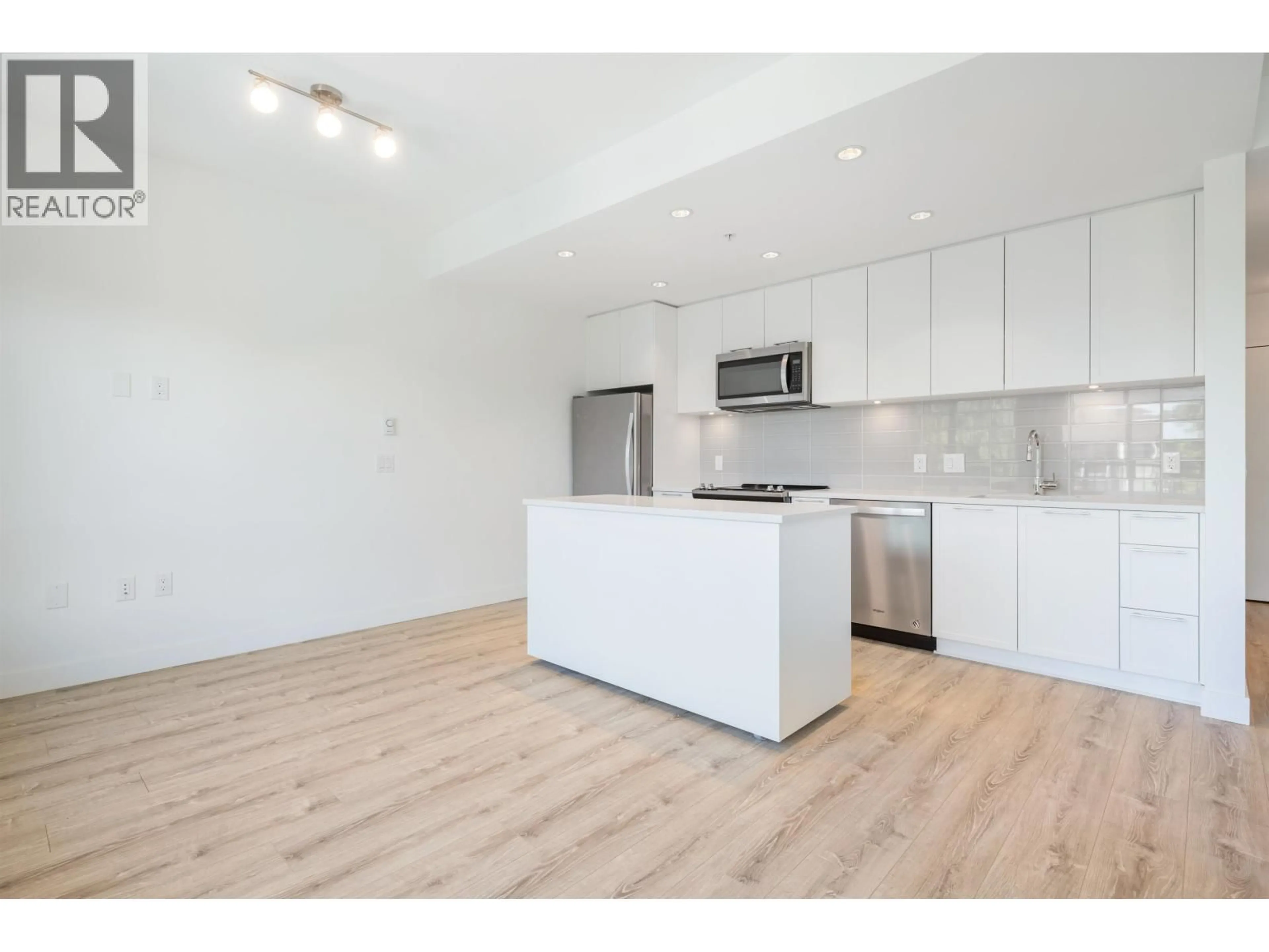 Open concept kitchen, wood/laminate floor for 407 - 2382 ATKINS AVENUE, Port Coquitlam British Columbia V3C0G7