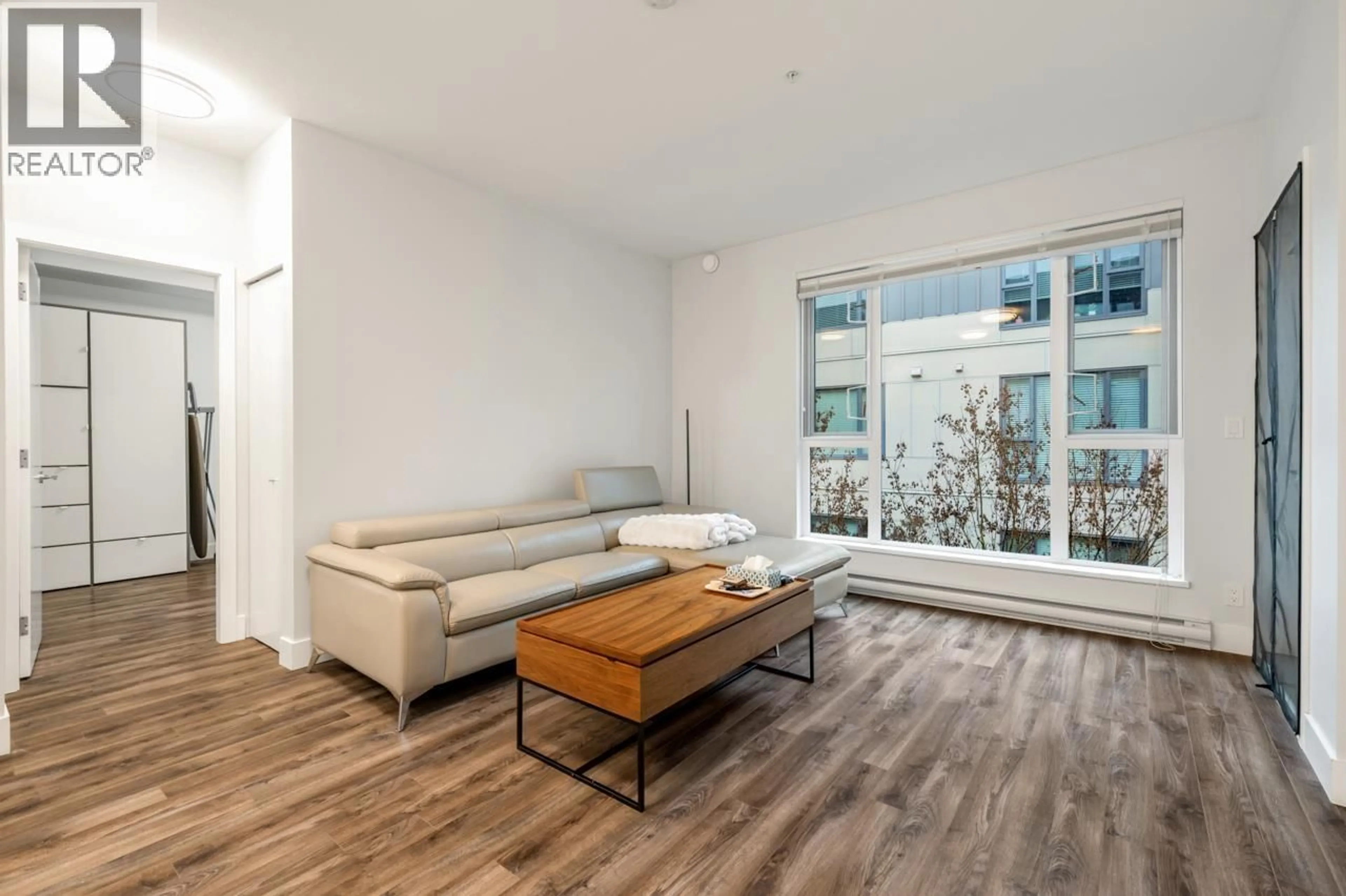 Living room with furniture, wood/laminate floor for 309 - 5355 LANE STREET, Burnaby British Columbia V5H0H1