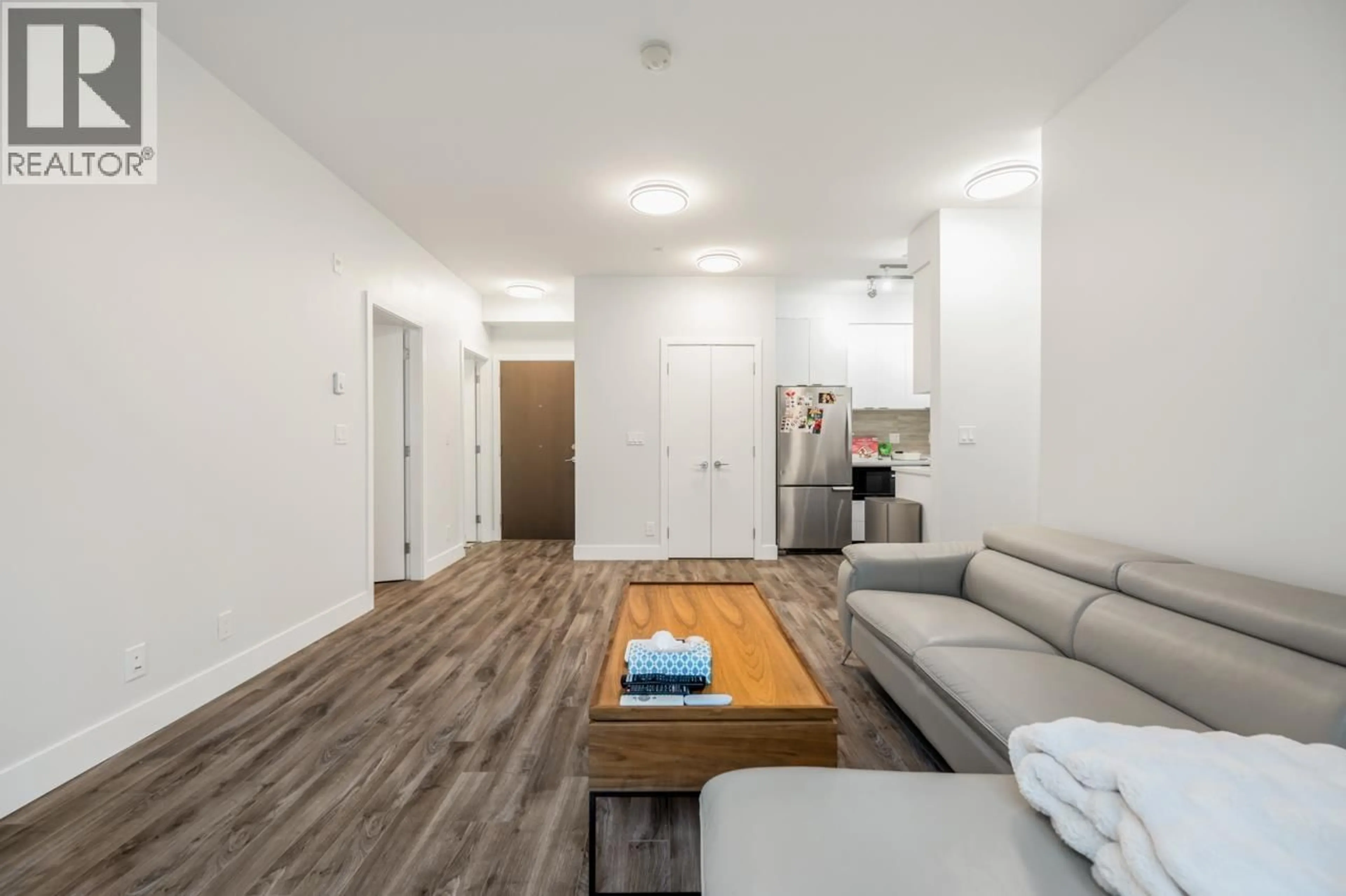 Living room with furniture, wood/laminate floor for 309 - 5355 LANE STREET, Burnaby British Columbia V5H0H1