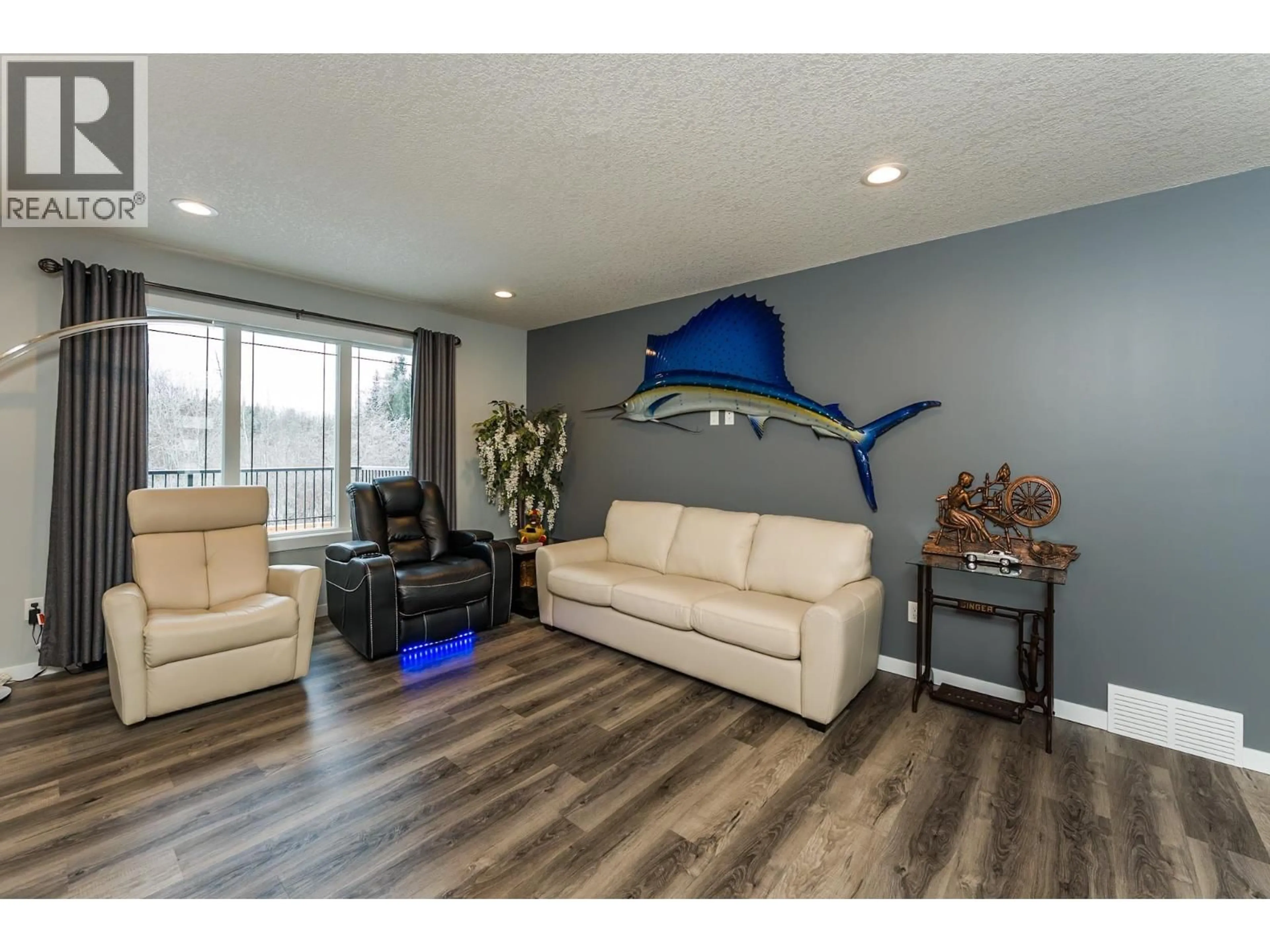 Living room with furniture, wood/laminate floor for 5488 VENTA DRIVE, Prince George British Columbia V2K0B6