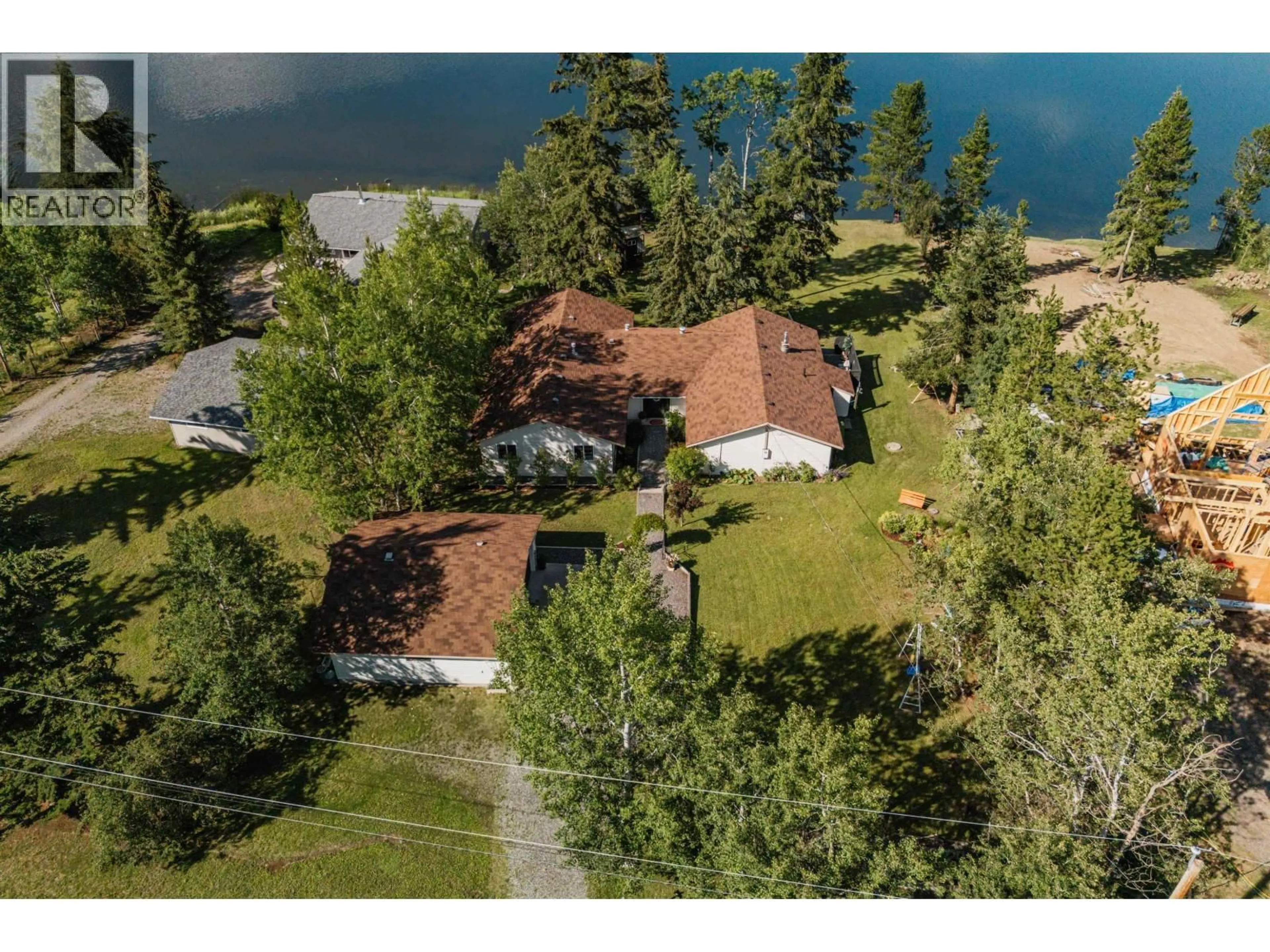 A pic from outside/outdoor area/front of a property/back of a property/a pic from drone, water/lake/river/ocean view for 5151 WATSON LAKE ROAD, 100 Mile House British Columbia V0K2E1