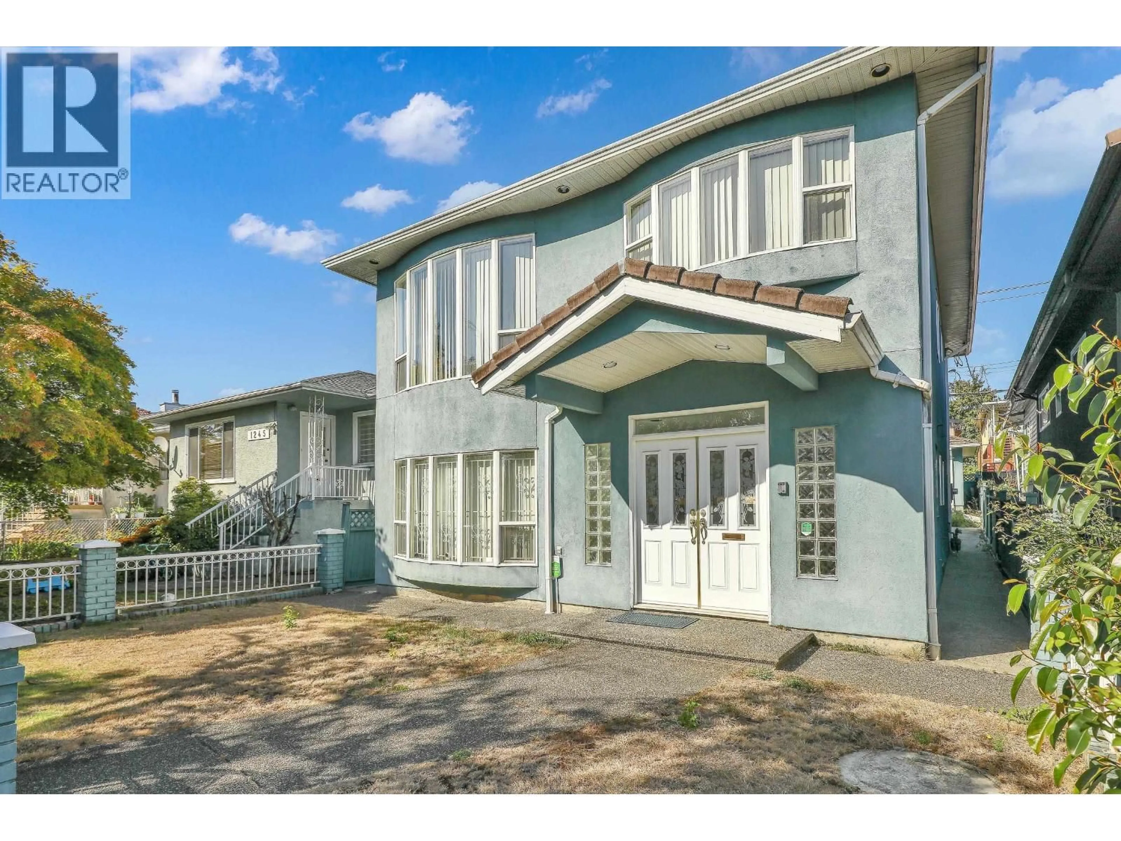 Home with vinyl exterior material, street for 1257 60TH AVENUE, Vancouver British Columbia V5X2A6