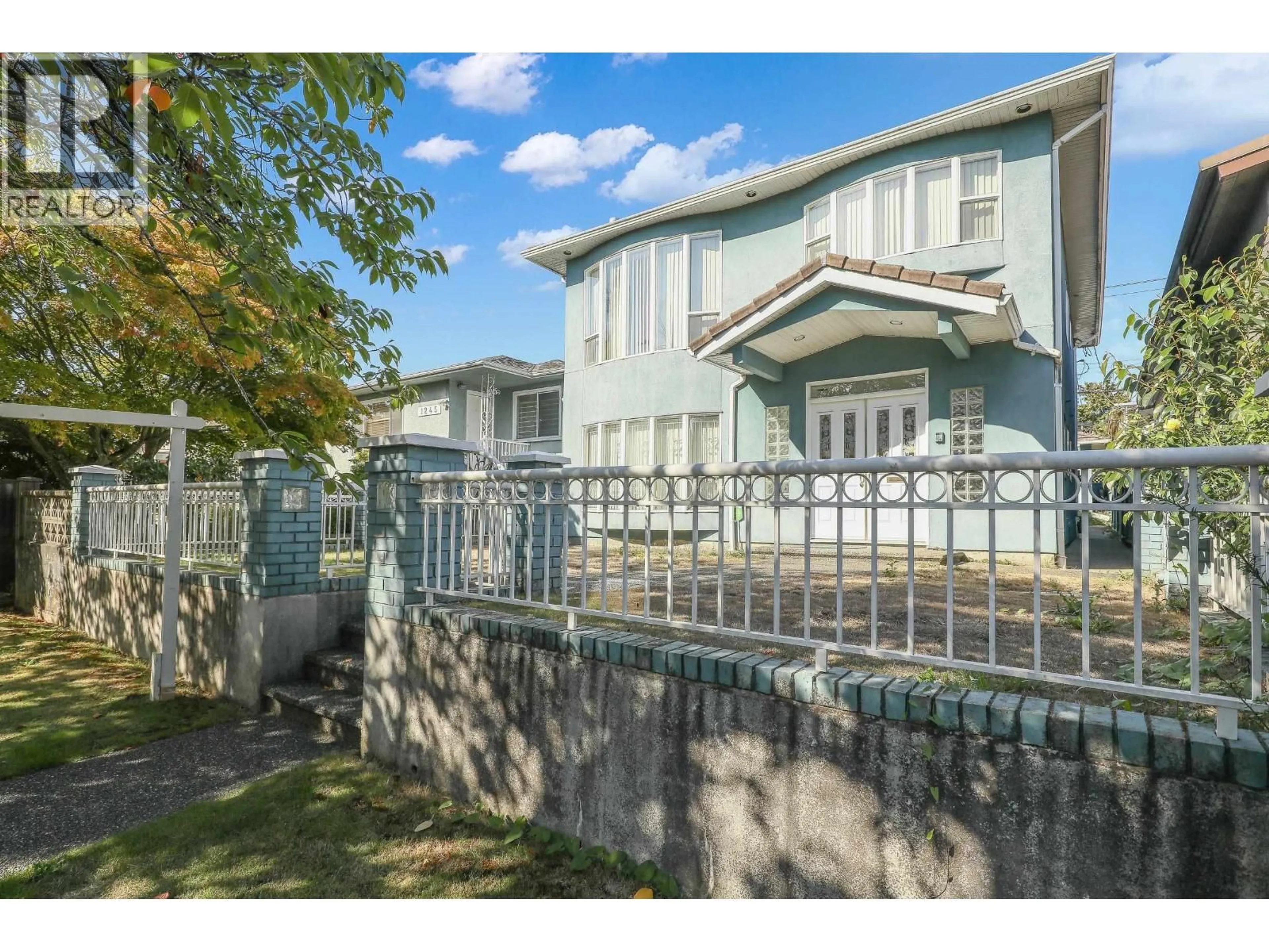 A pic from outside/outdoor area/front of a property/back of a property/a pic from drone, street for 1257 60TH AVENUE, Vancouver British Columbia V5X2A6