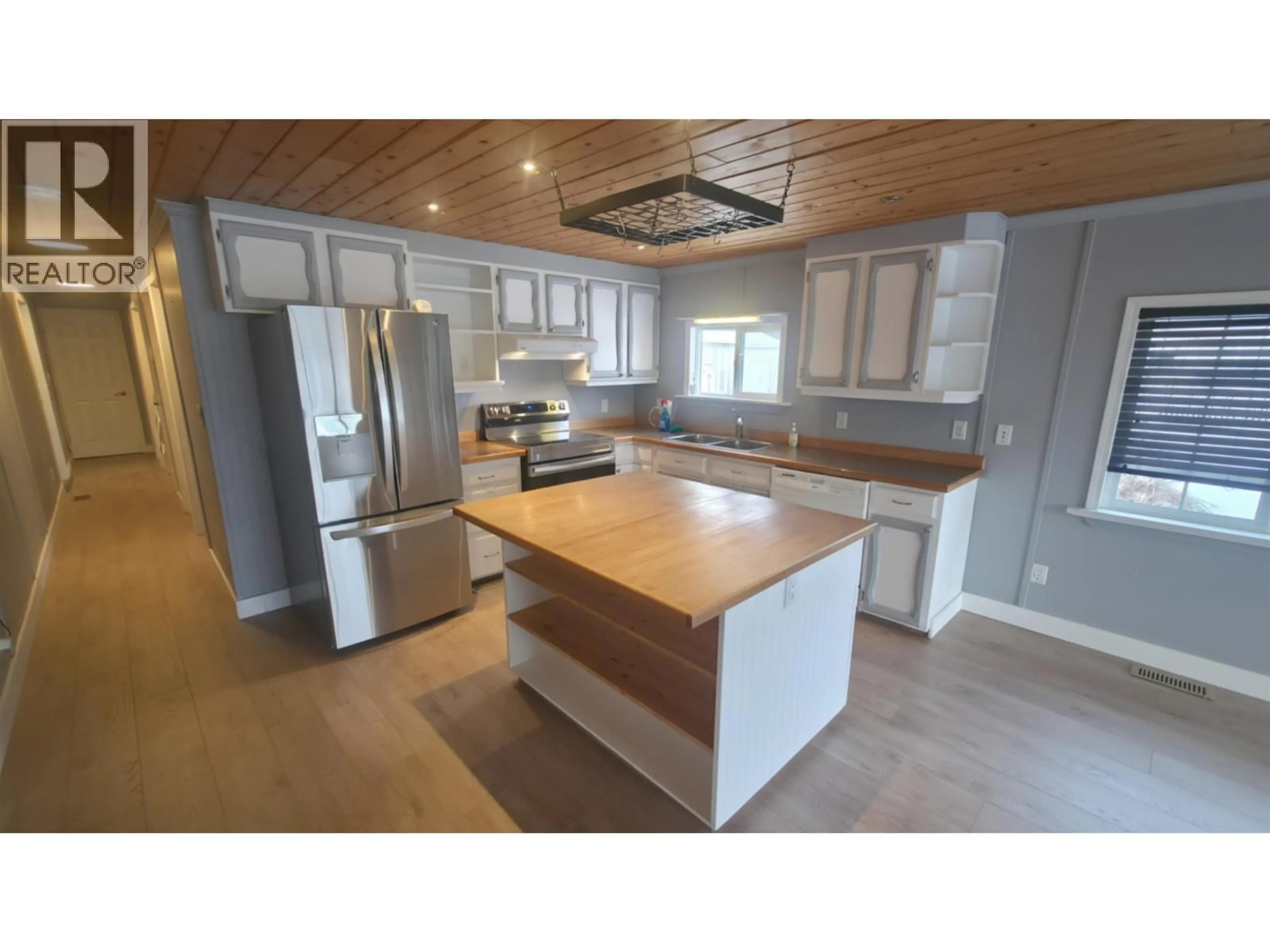 Open concept kitchen, wood/laminate floor for 3293 5TH STREET, Houston British Columbia V0J1Z0