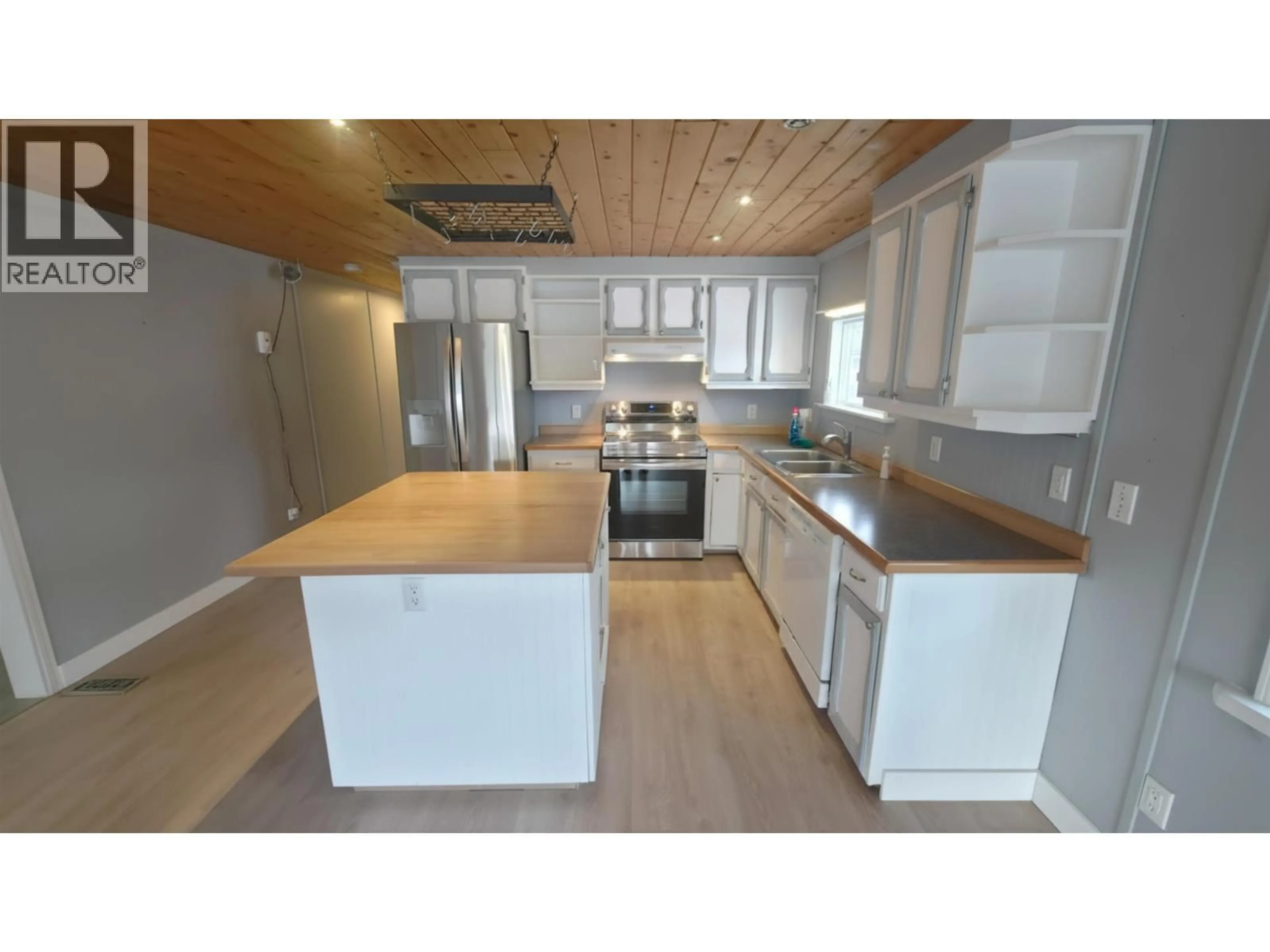 Open concept kitchen, wood/laminate floor for 3293 5TH STREET, Houston British Columbia V0J1Z0