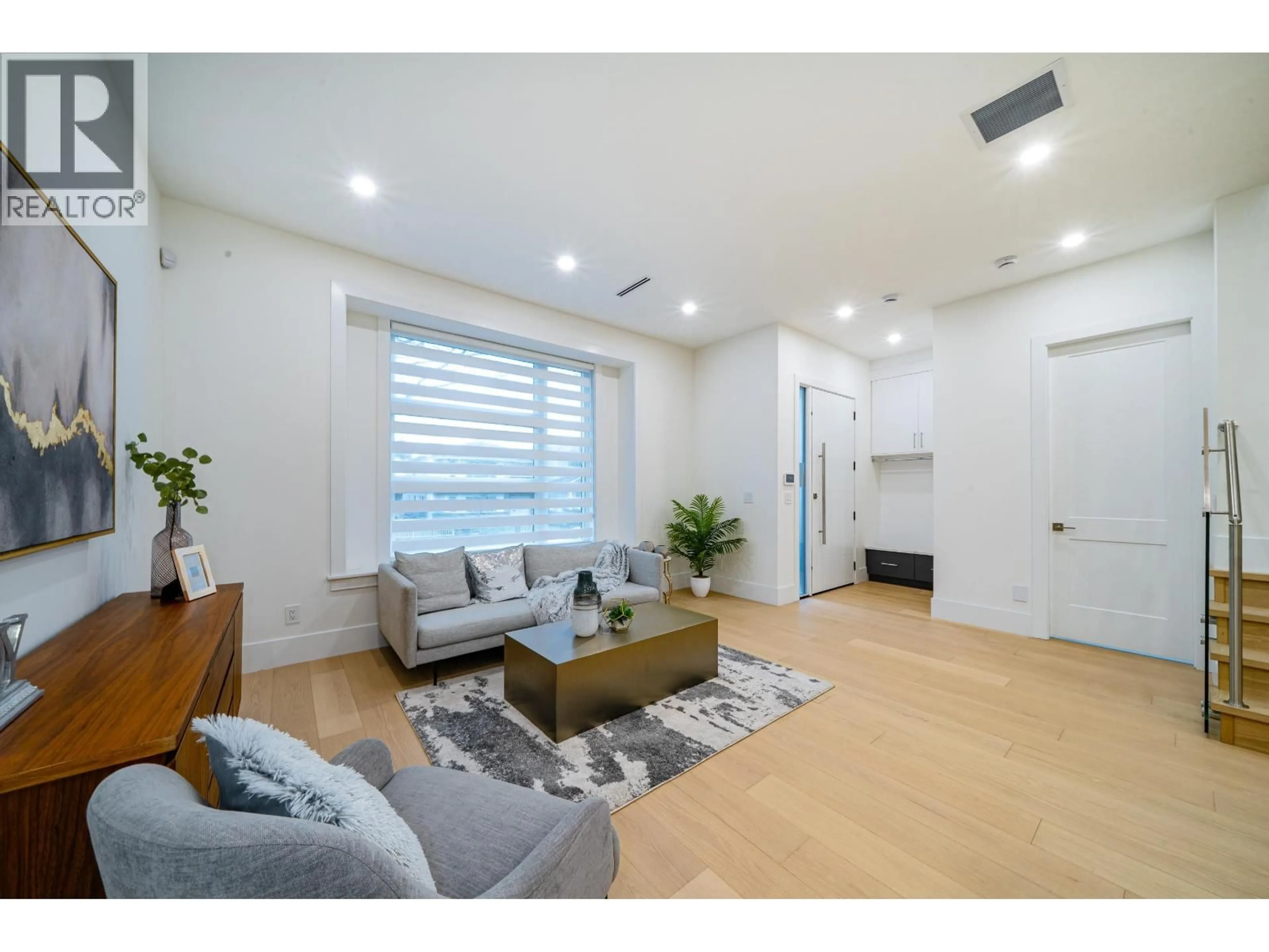 Living room with furniture, wood/laminate floor for 1 - 4210 UNION STREET, Burnaby British Columbia V5C2X4