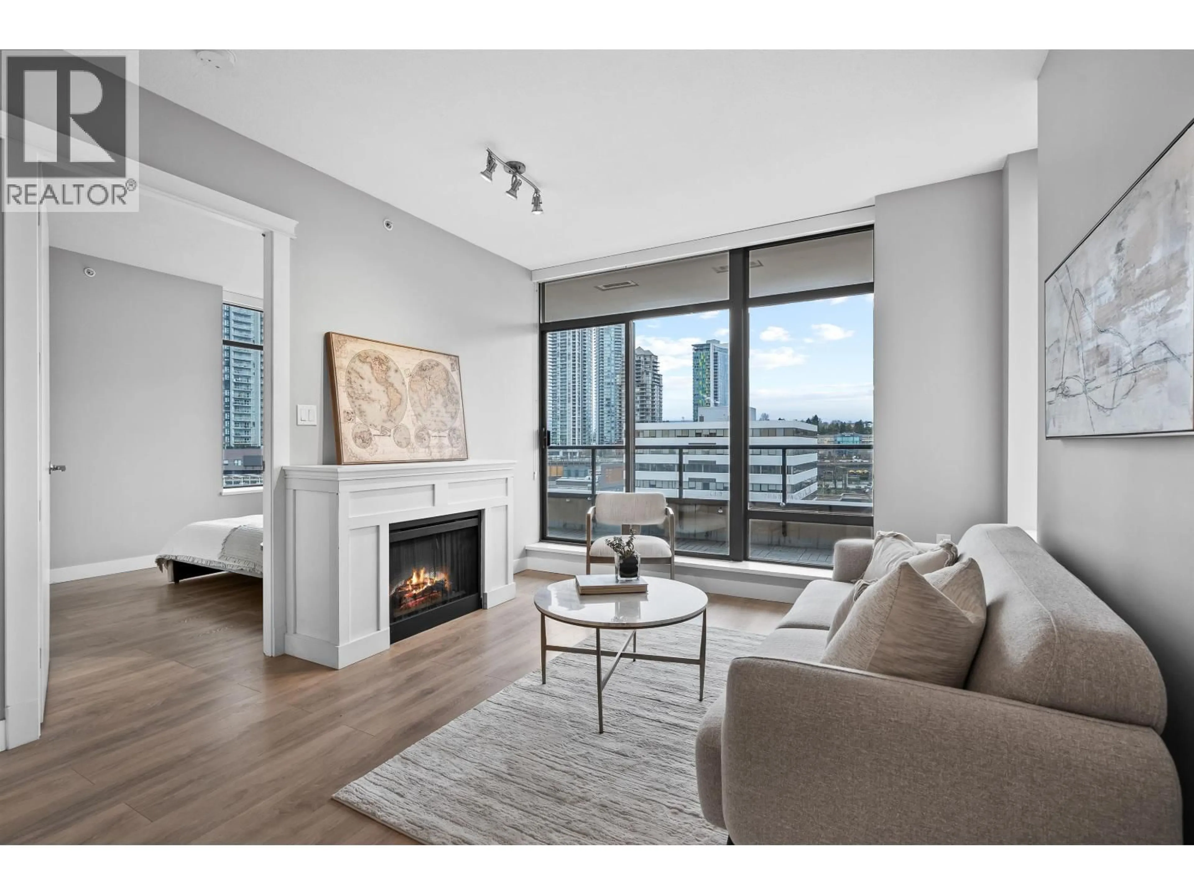 Living room with furniture, wood/laminate floor for 902 - 4250 DAWSON STREET, Burnaby British Columbia V5C4B1