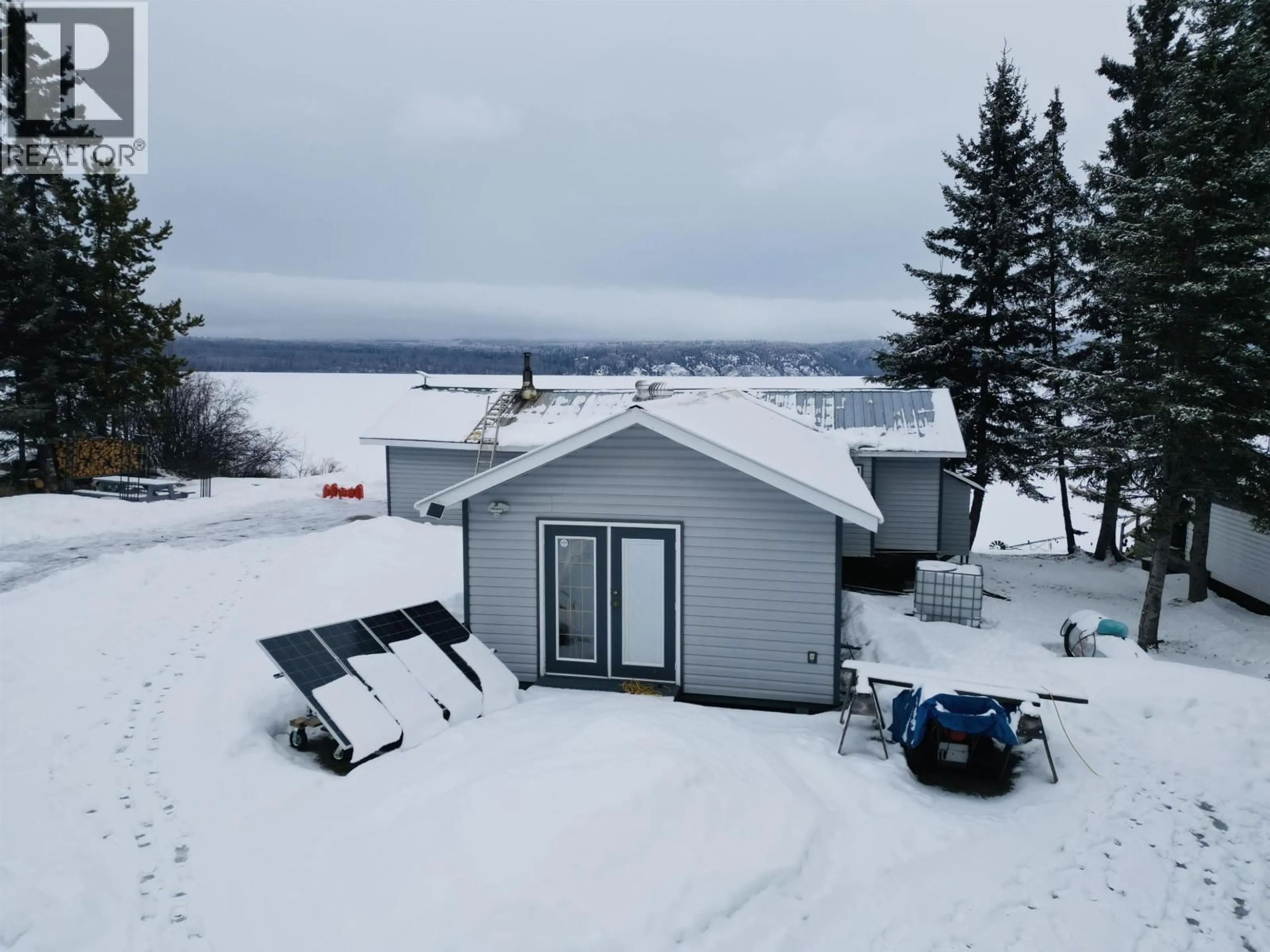 A pic from outside/outdoor area/front of a property/back of a property/a pic from drone, water/lake/river/ocean view for 39722 BABINE LAKE ROAD, Burns Lake British Columbia V0J1E0