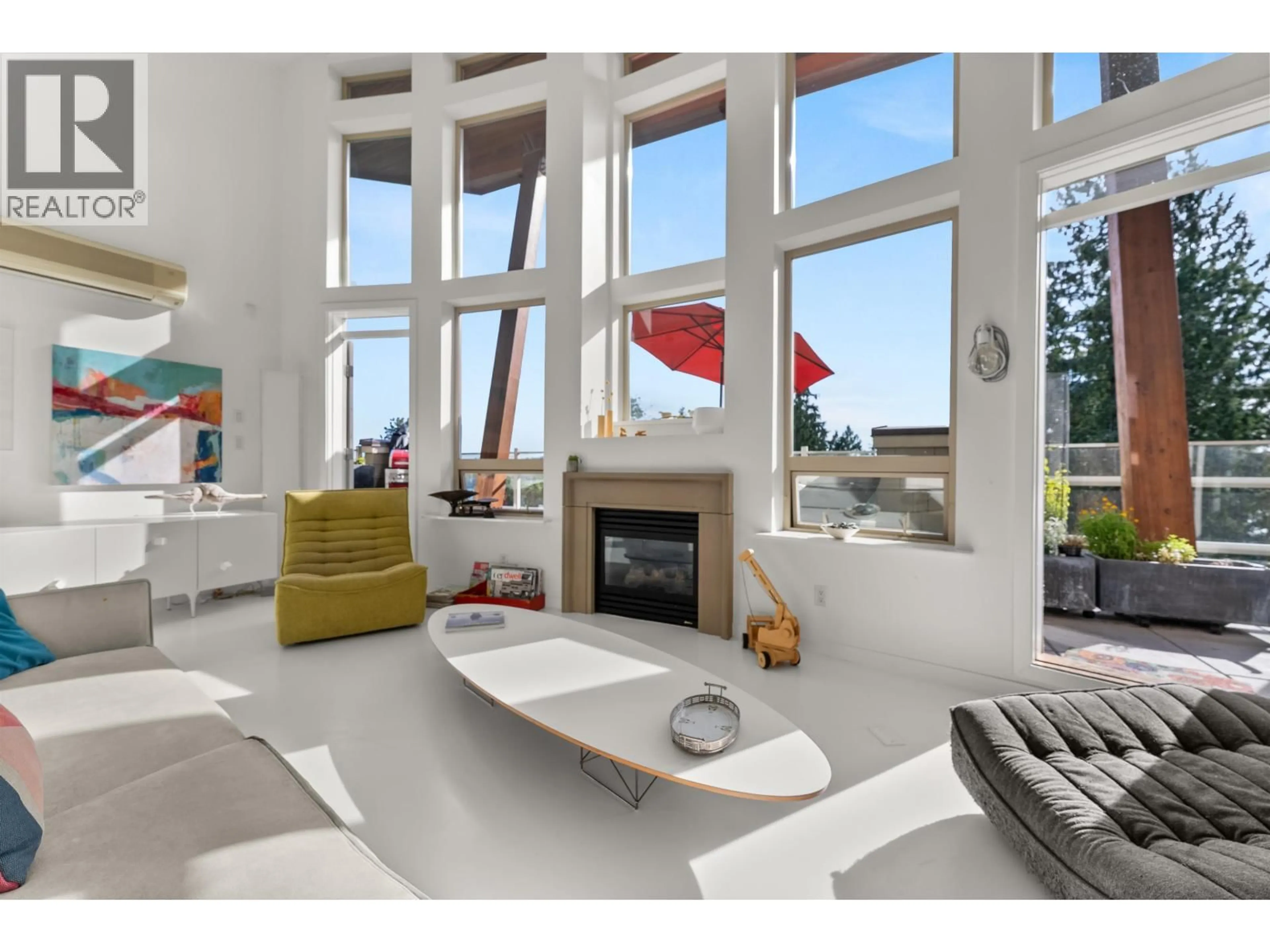 Living room with furniture, ceramic/tile floor for 501 - 560 RAVEN WOODS DRIVE, North Vancouver British Columbia V7G2T3