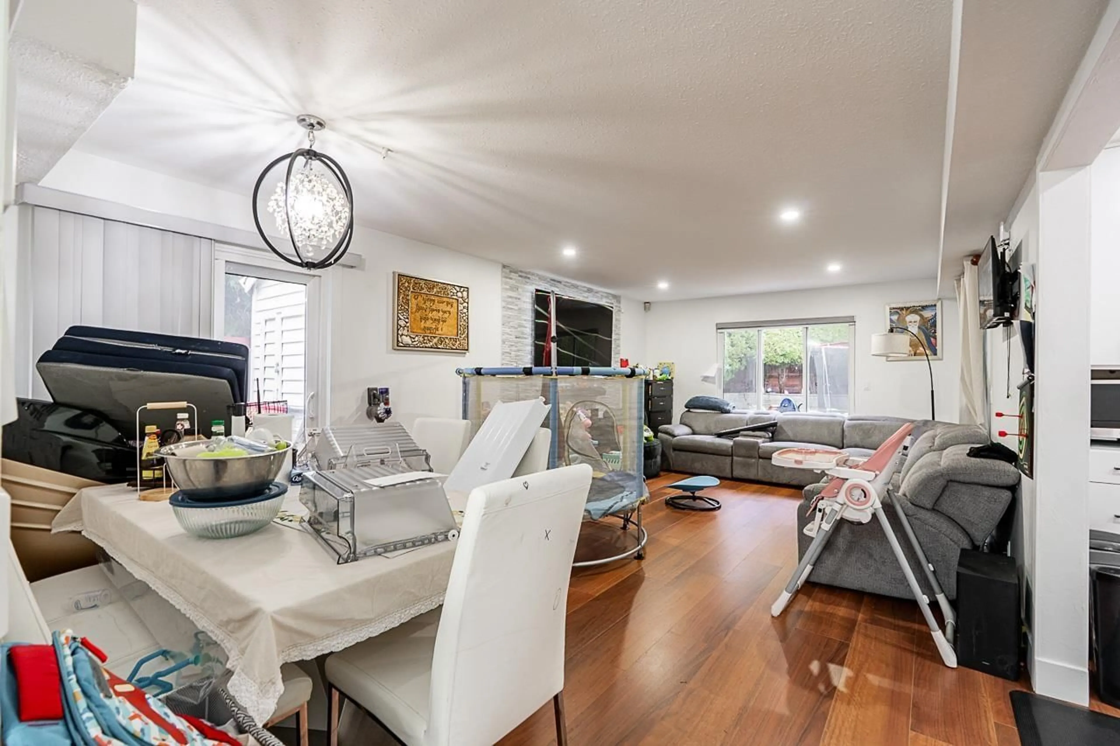 Living room with furniture, wood/laminate floor for 12501 76A AVENUE, Surrey British Columbia V3W7W5