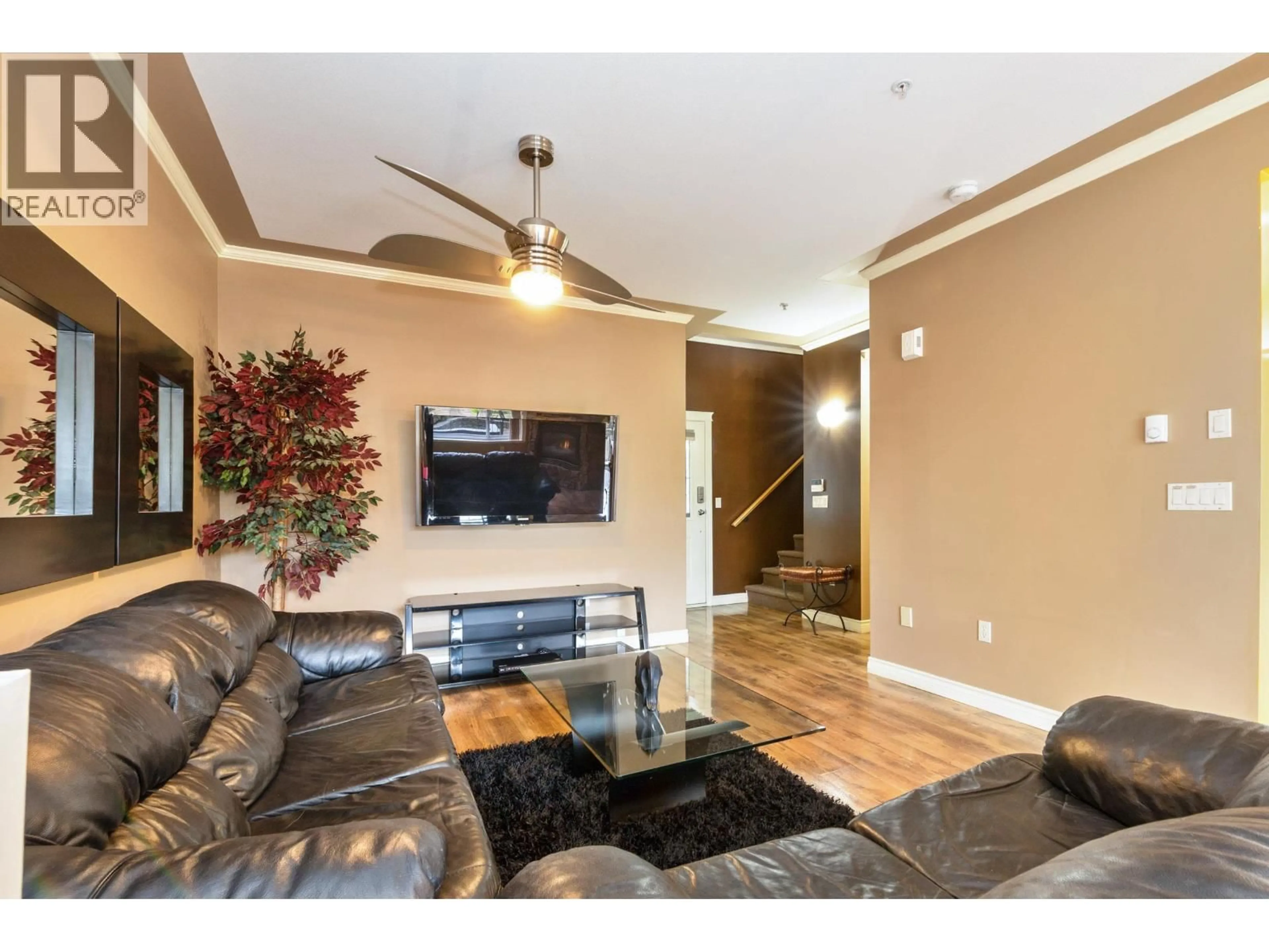 Living room with furniture, wood/laminate floor for 8 - 19148 124 AVENUE, Pitt Meadows British Columbia V3Y2V2