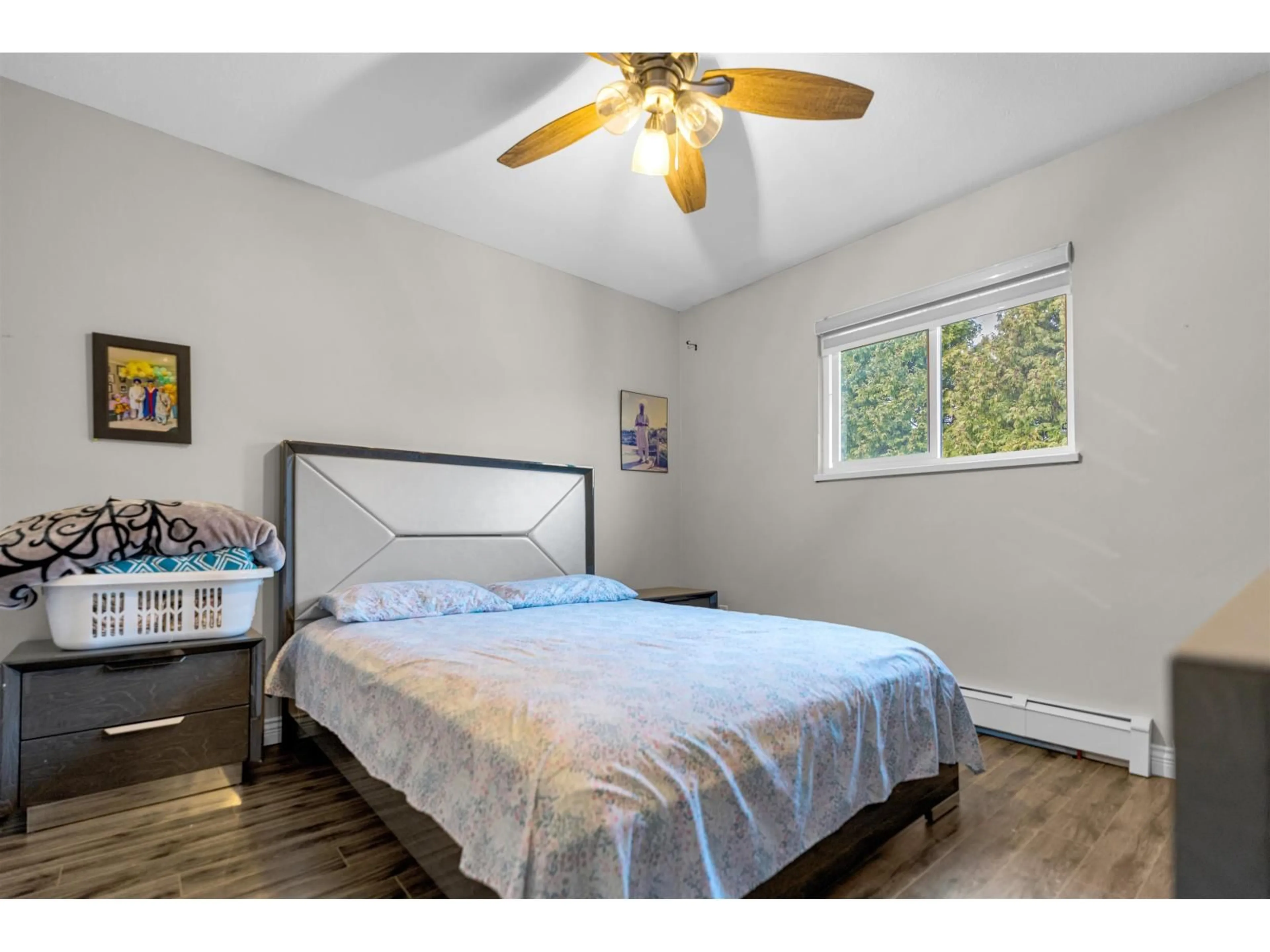 Bedroom with bed, wood/laminate floor for 7595 122A STREET, Surrey British Columbia V3W0K7