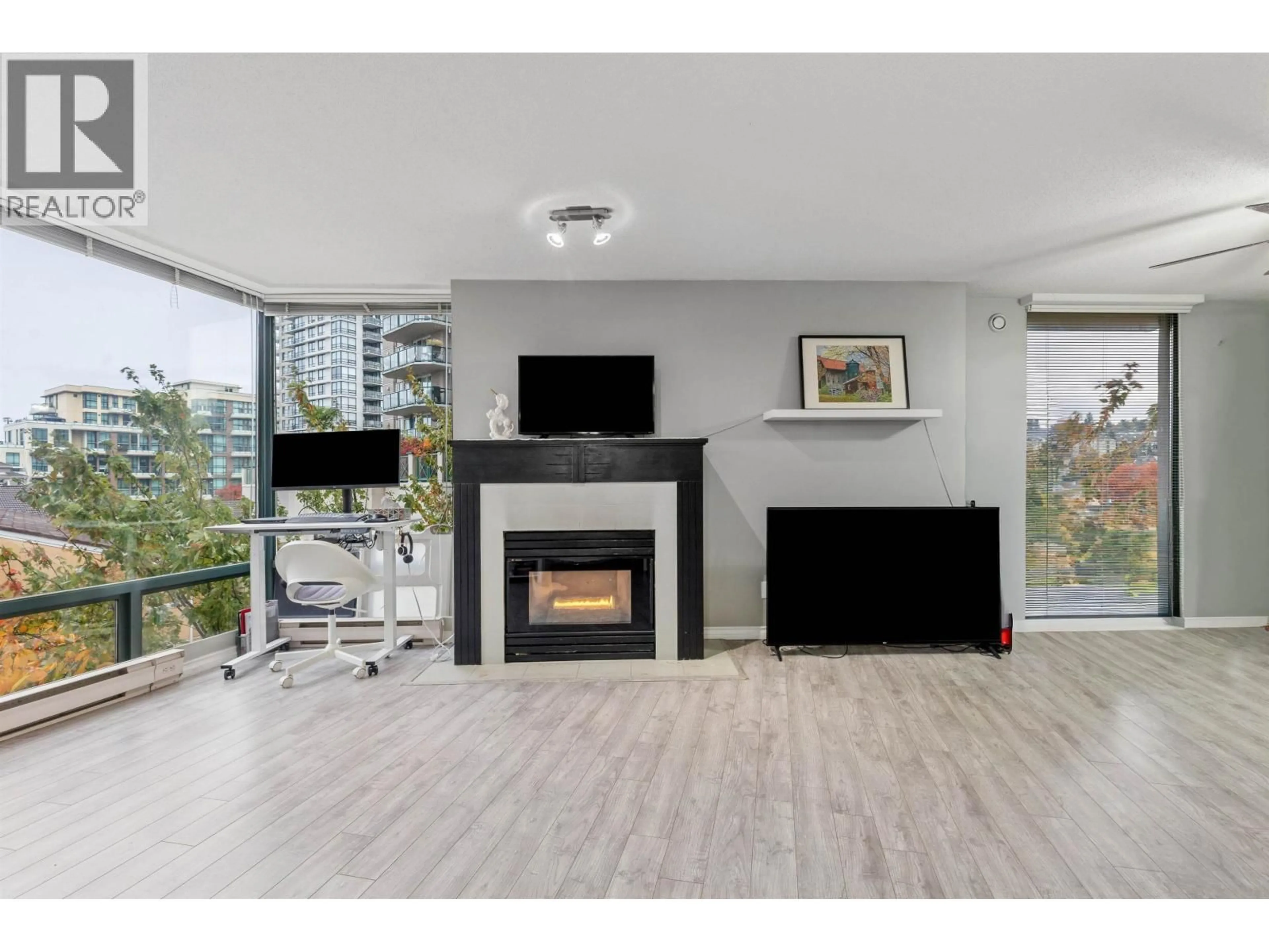 Living room with furniture, wood/laminate floor for 507 - 8 LAGUNA COURT, New Westminster British Columbia V3M6M6