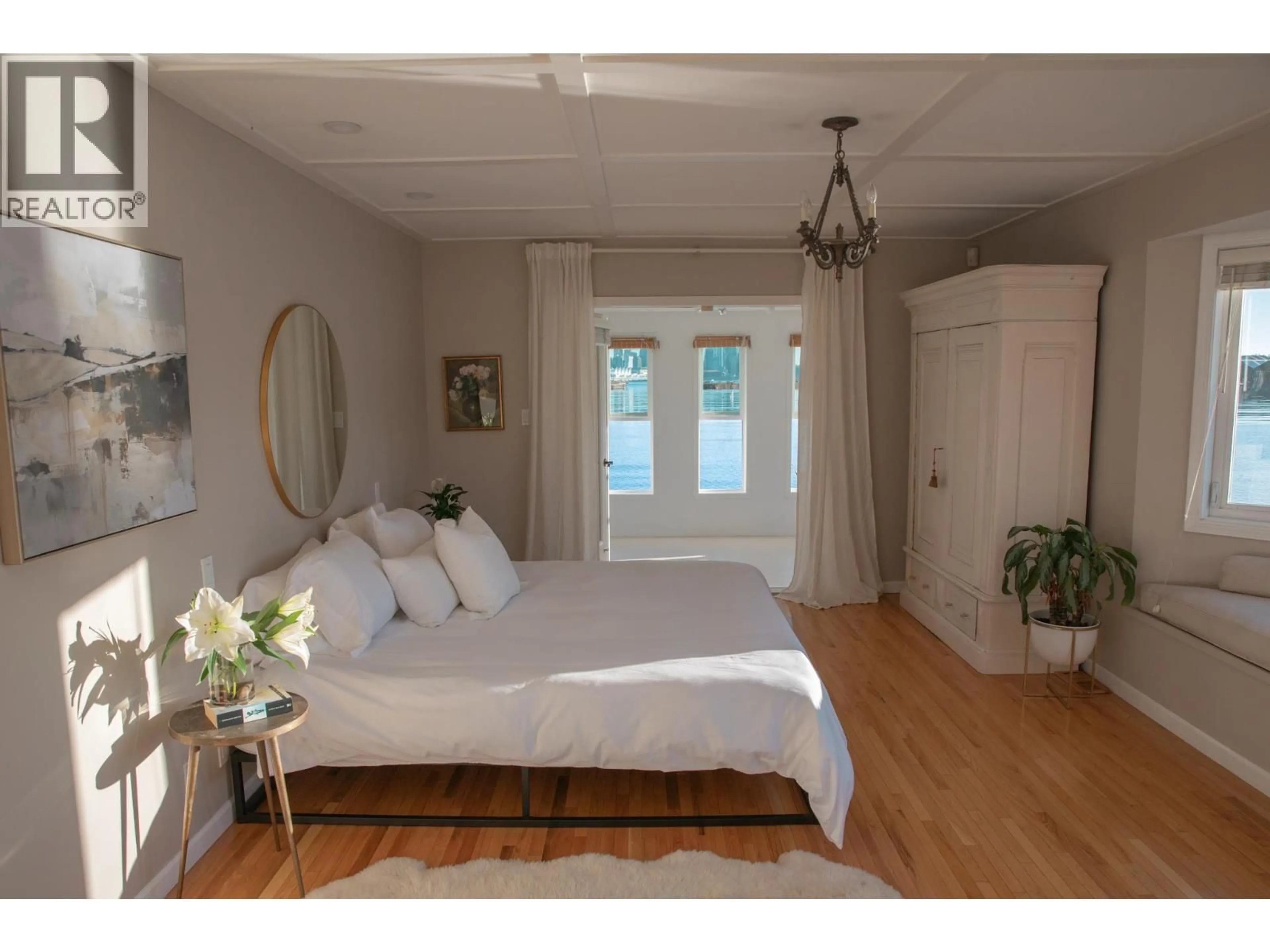 Bedroom with bed, wood/laminate floor for A27 - 415 ESPLANADE AVENUE, North Vancouver British Columbia V7M1A6